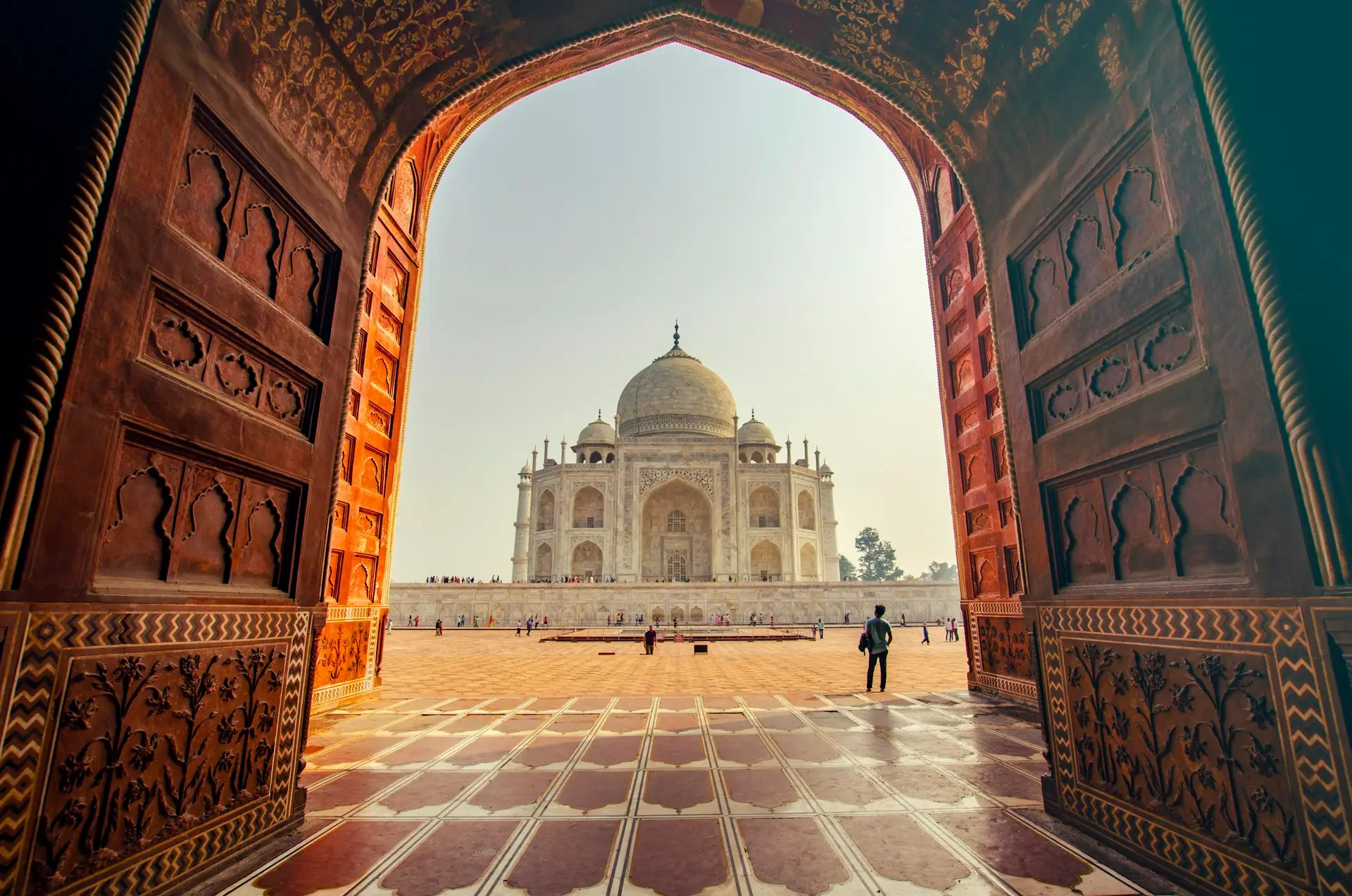 The Taj Mahal seen through the arch of its great gateway at dawn