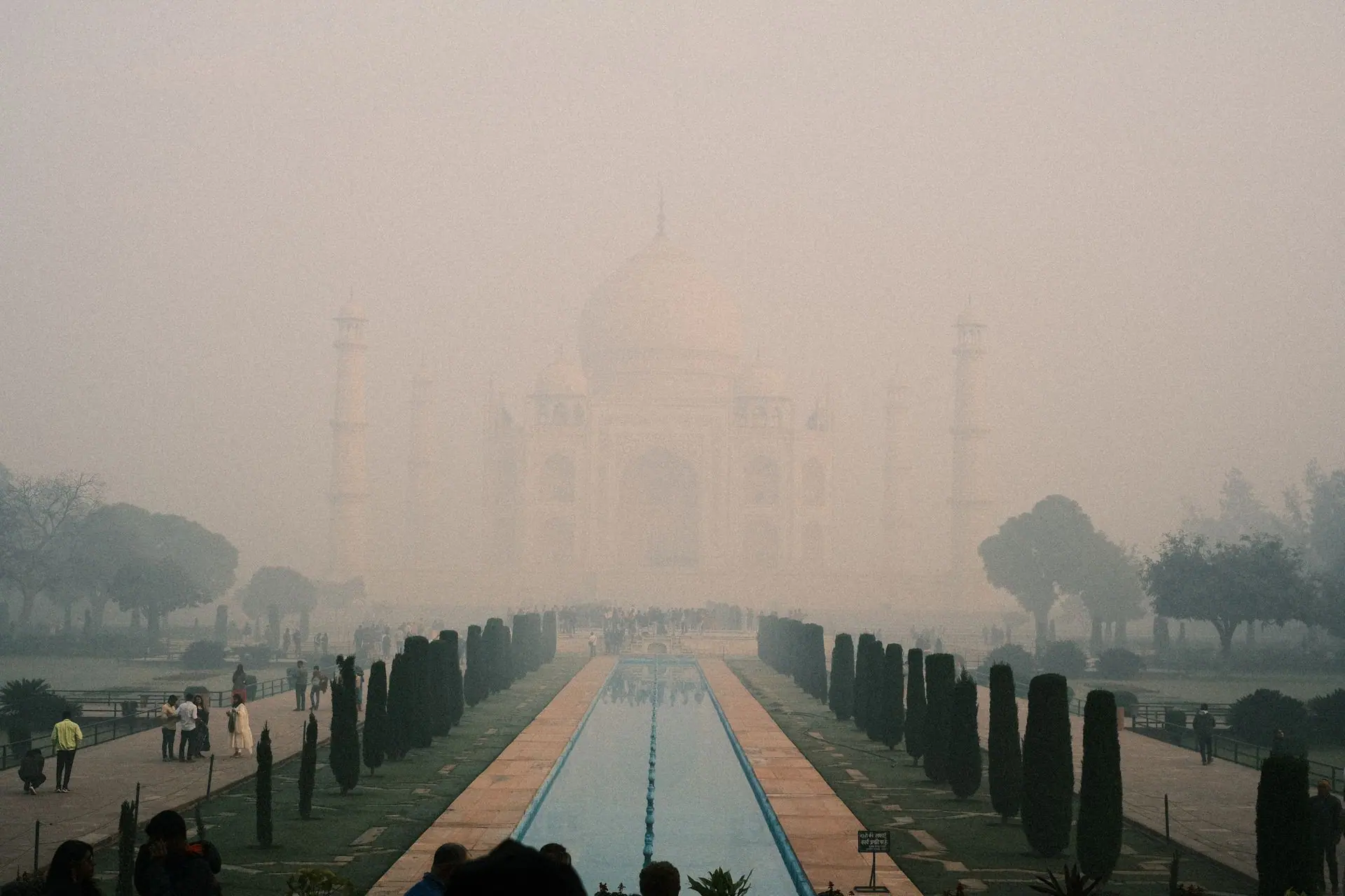 Foggy morning at Taj Mahal, showcasing its ethereal beauty amidst heavy fog. A must-see for travelers in Agra, India