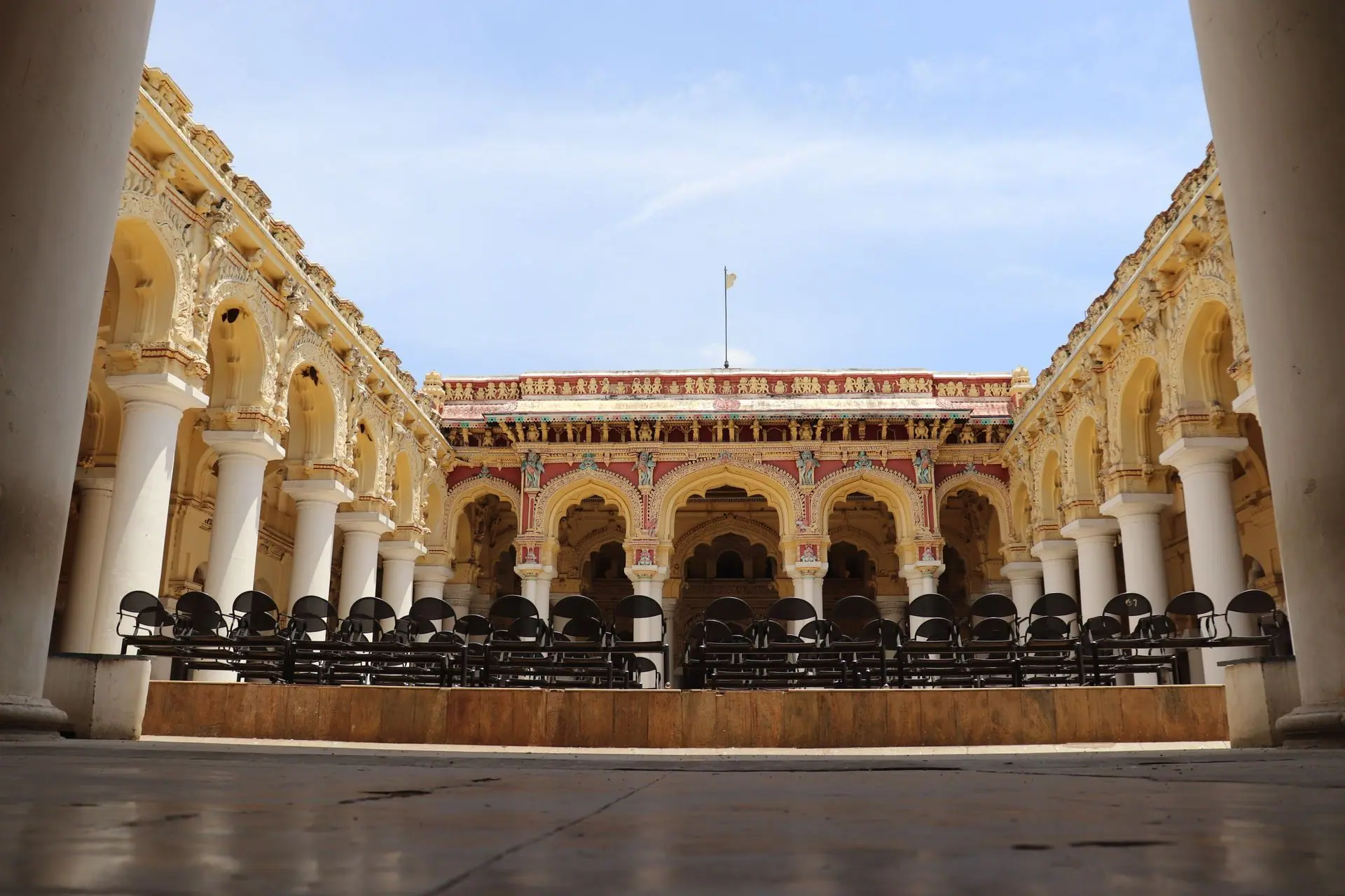 Beautiful view of Thirumalai Nayakkar Mahal's courtyard showcasing its ornate columns and architecture in Madurai, India