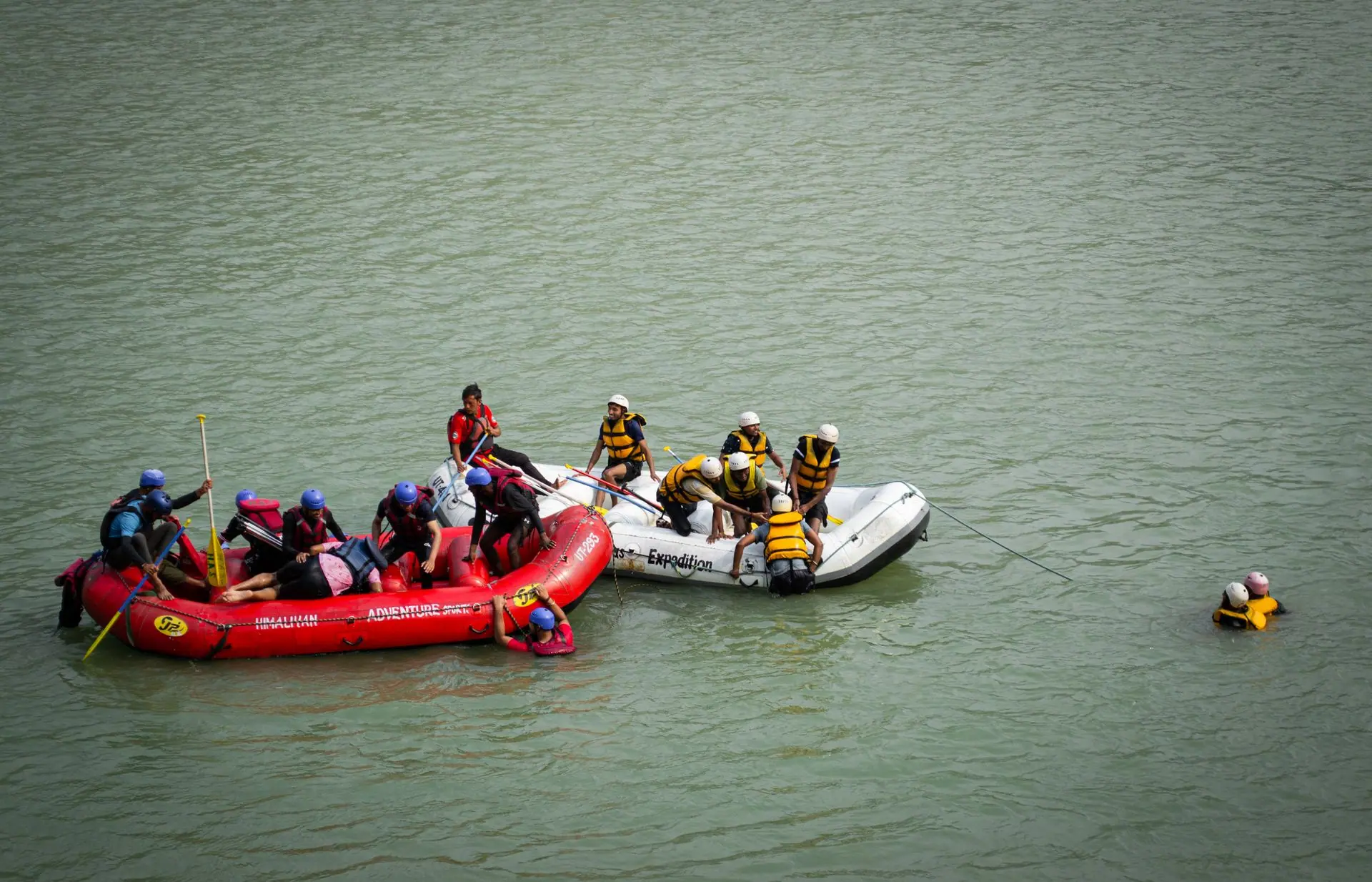Group rafting on Ganges River in Rishikesh, India showcasing teamwork in action