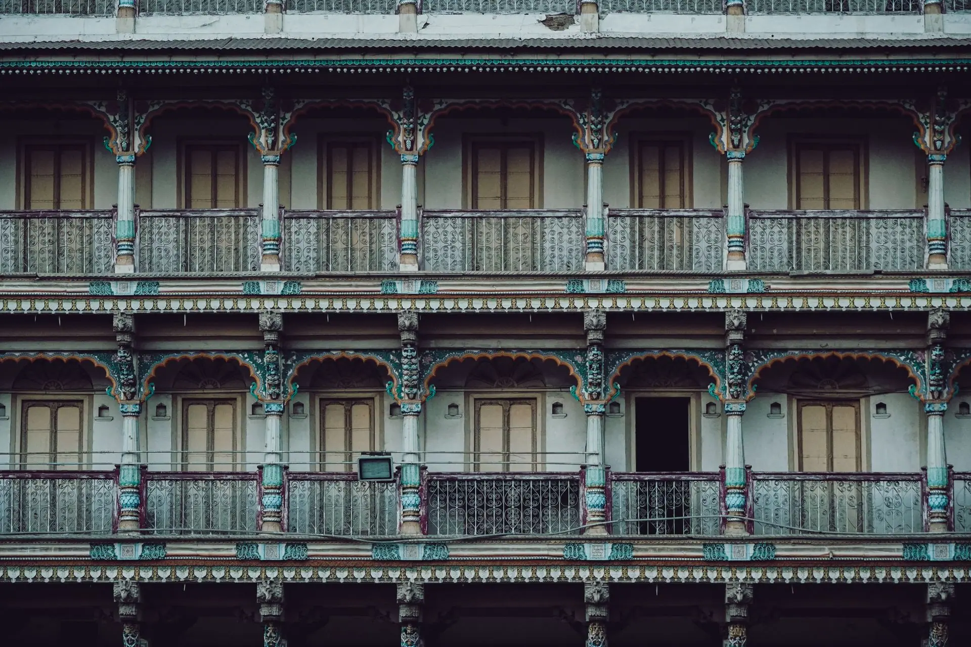 A vibrant multi-story historic facade showcasing traditional architecture in Ahmedabad, India