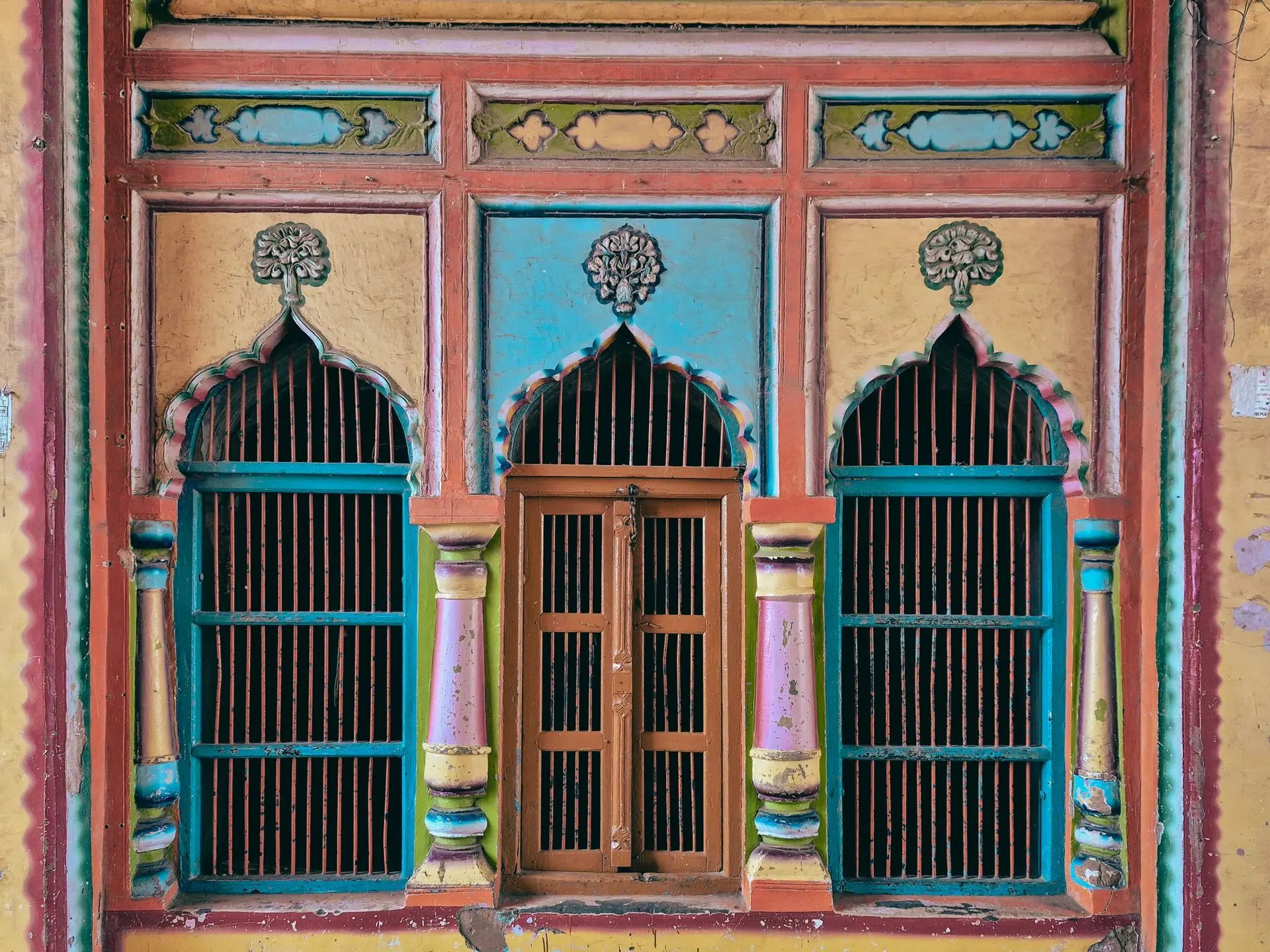 Colorful traditional windows with intricate designs in Ayodhya, Uttar Pradesh, India
