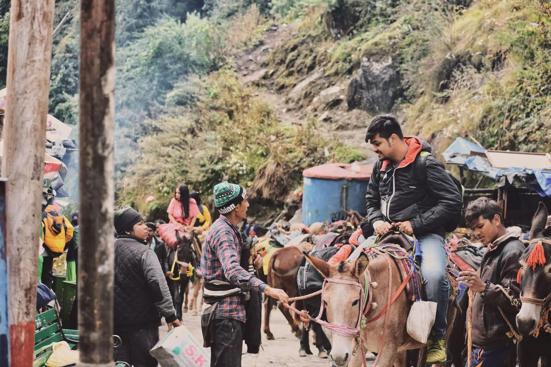 A bustling horseback riding scene in Kedarnath, India, showcasing local culture and adventure