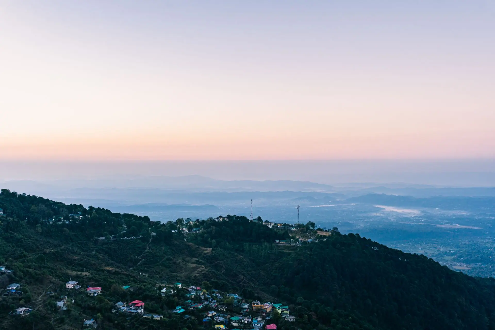 Breathtaking aerial view of Dalhousie hills at sunset with a vibrant sky