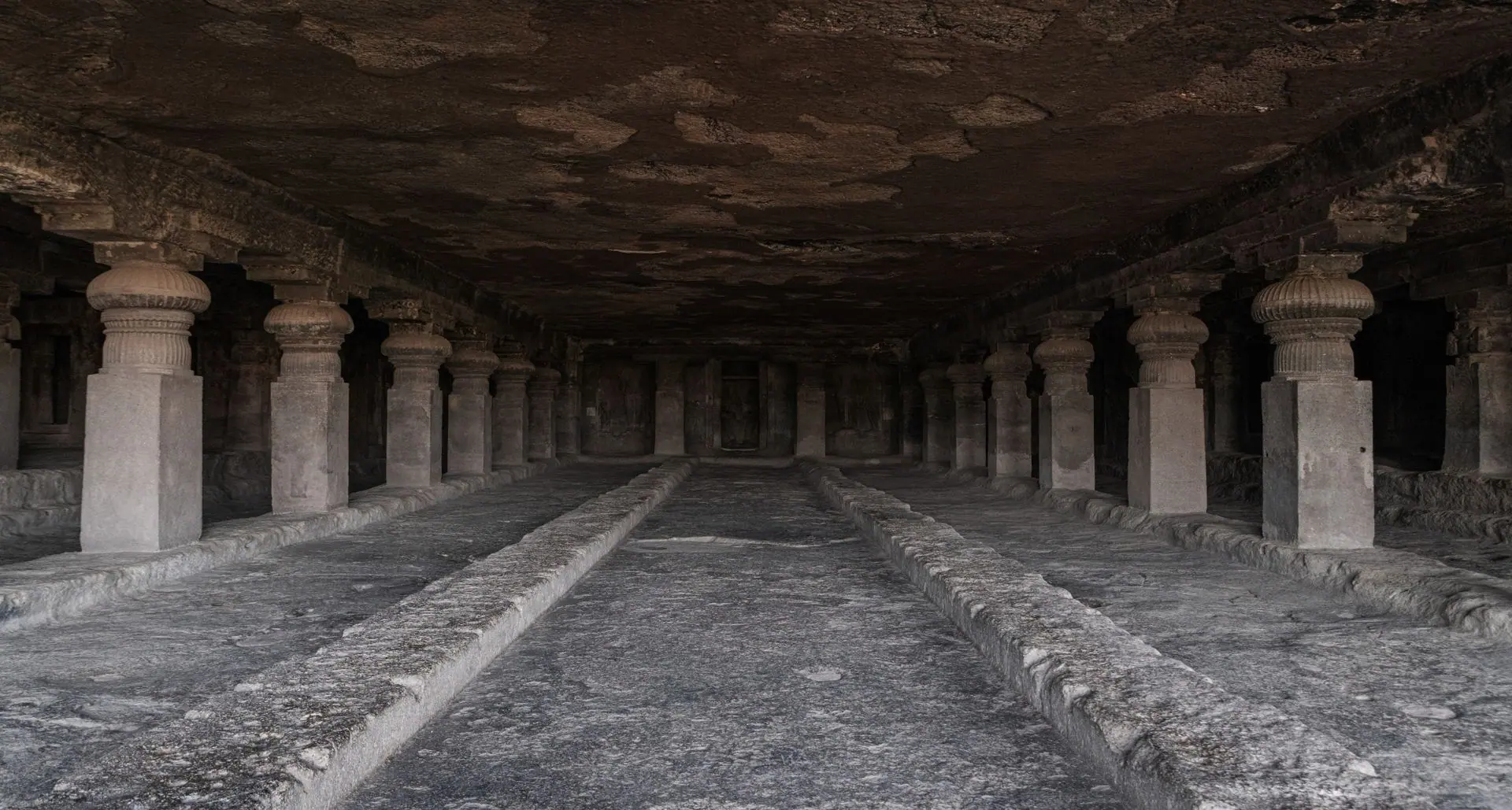 Explore the historic rock-cut caves of Ellora, Maharashtra, showcasing ancient architectural marvels