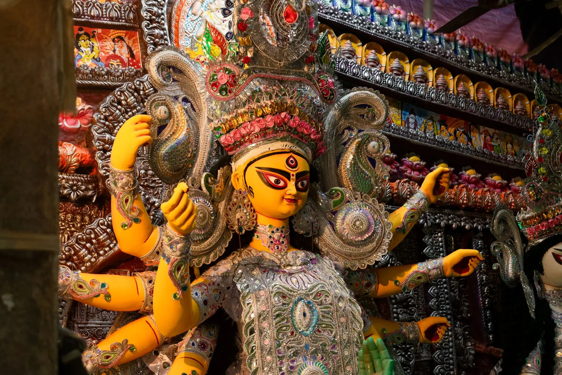Vibrant Durga idol decorated during Durga Puja in Kolkata, India, showcasing traditional artistry