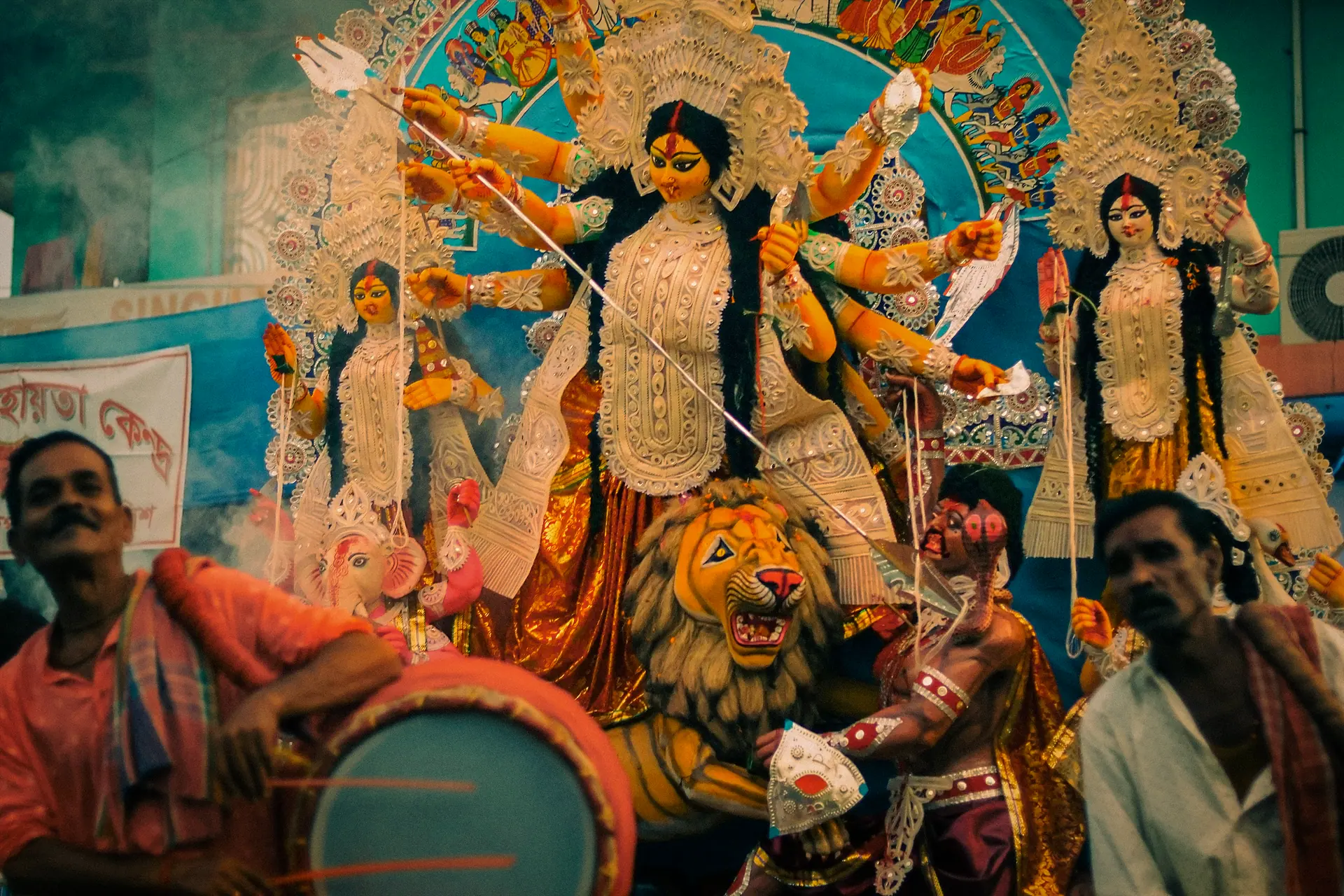 Colorful Durga Puja festival scene with devotional figures and vibrant decorations