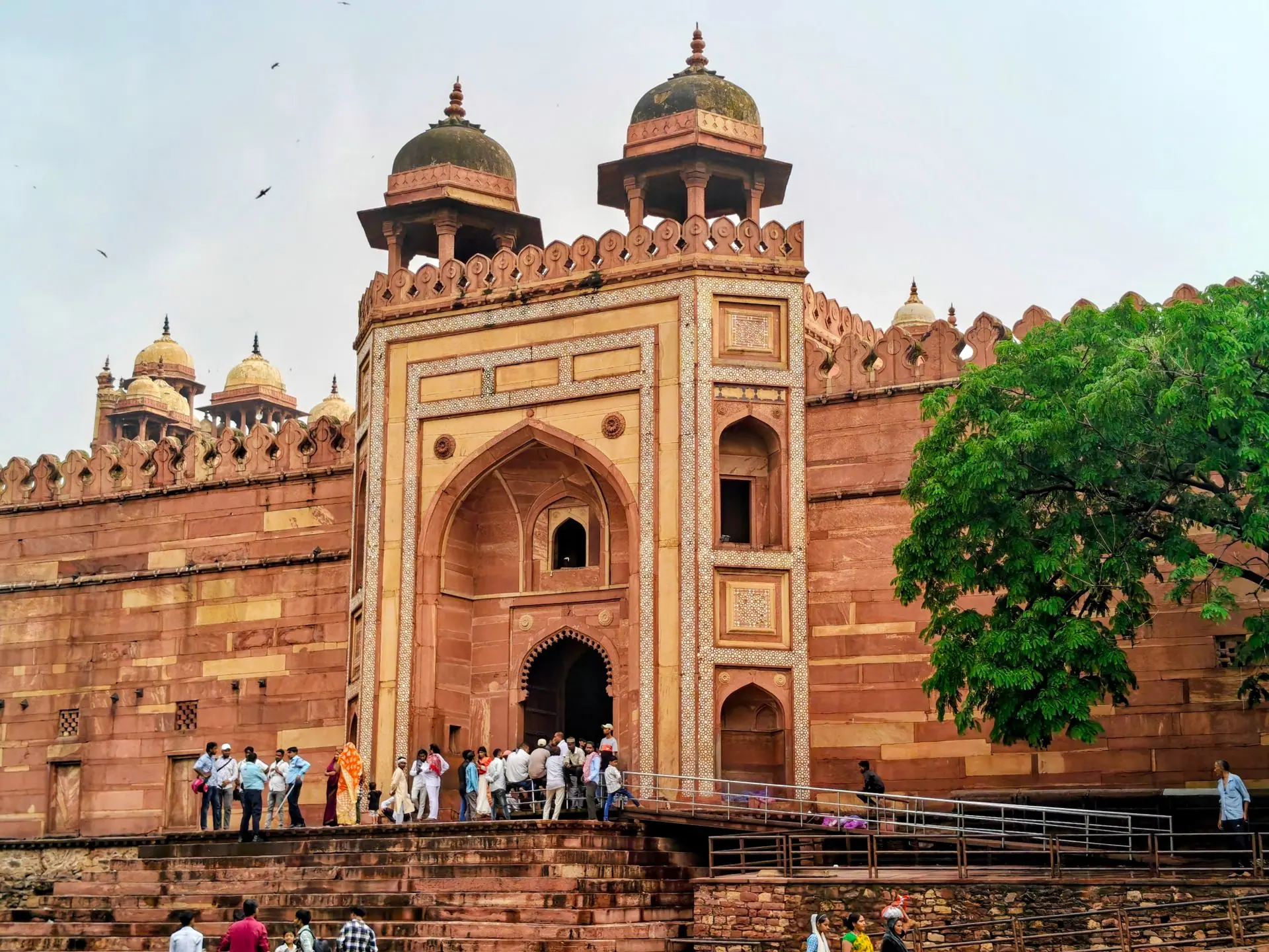 Tourists gather at the grand Buland Darwaza entrance in historic Fatehpur Sikri