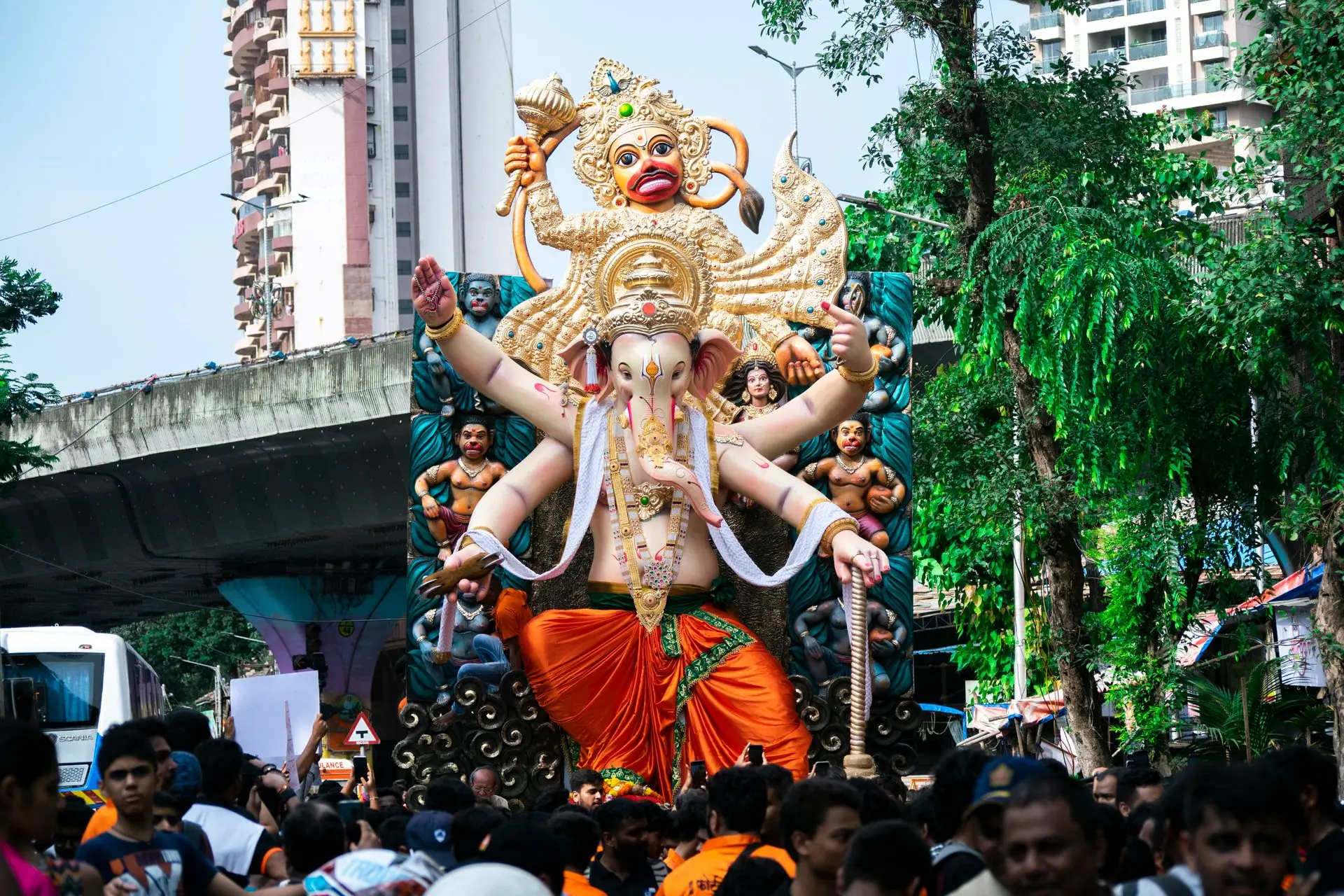 Crowds celebrate Ganesh Chaturthi with a large Ganesha statue in Mumbai streets