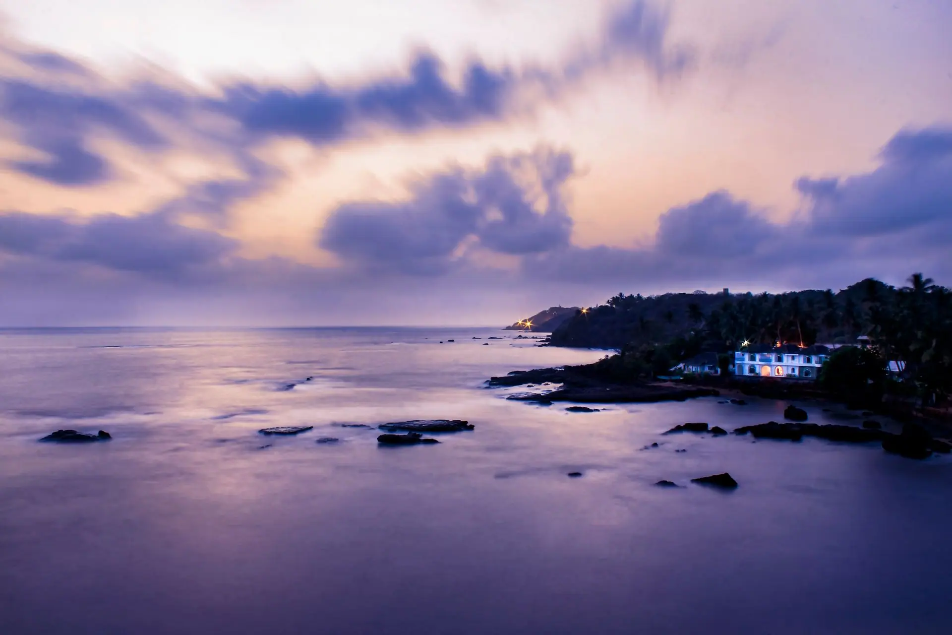 Beautiful seascape at dusk with dramatic clouds and coastal view in Goa, India. Perfect for travel and nature themes
