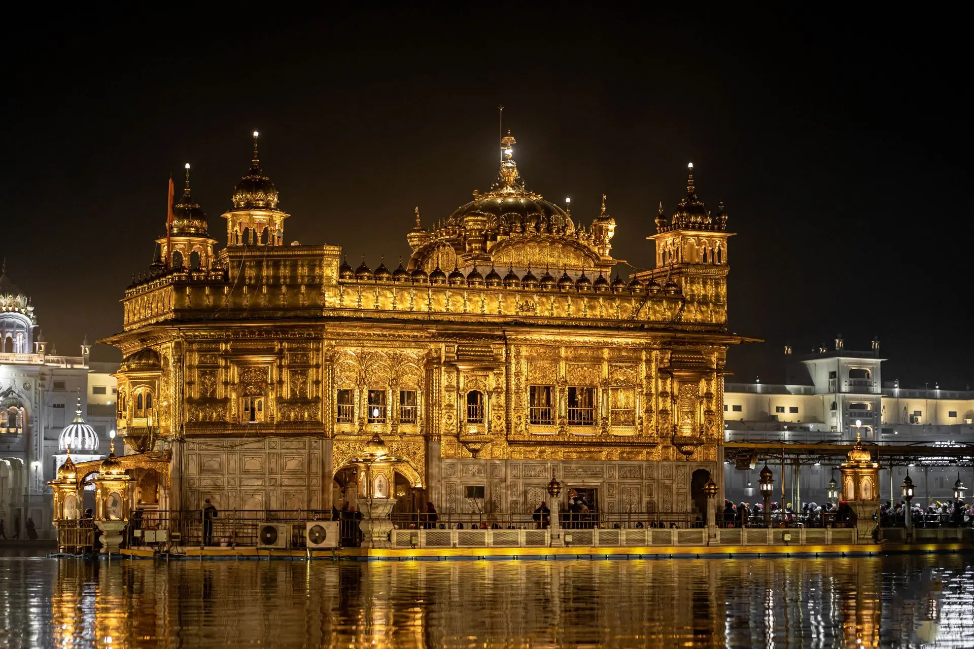 Stunning night view of the illuminated Golden Temple, Amritsar, reflecting in the water