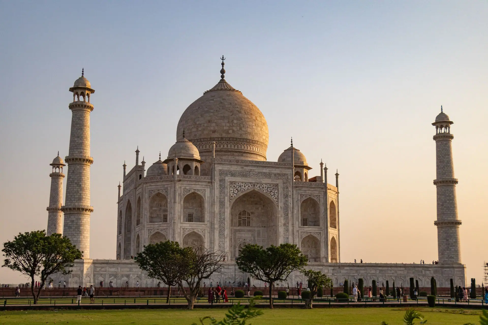 Beautiful view of the iconic Taj Mahal in Agra, India at sunset with clear skies