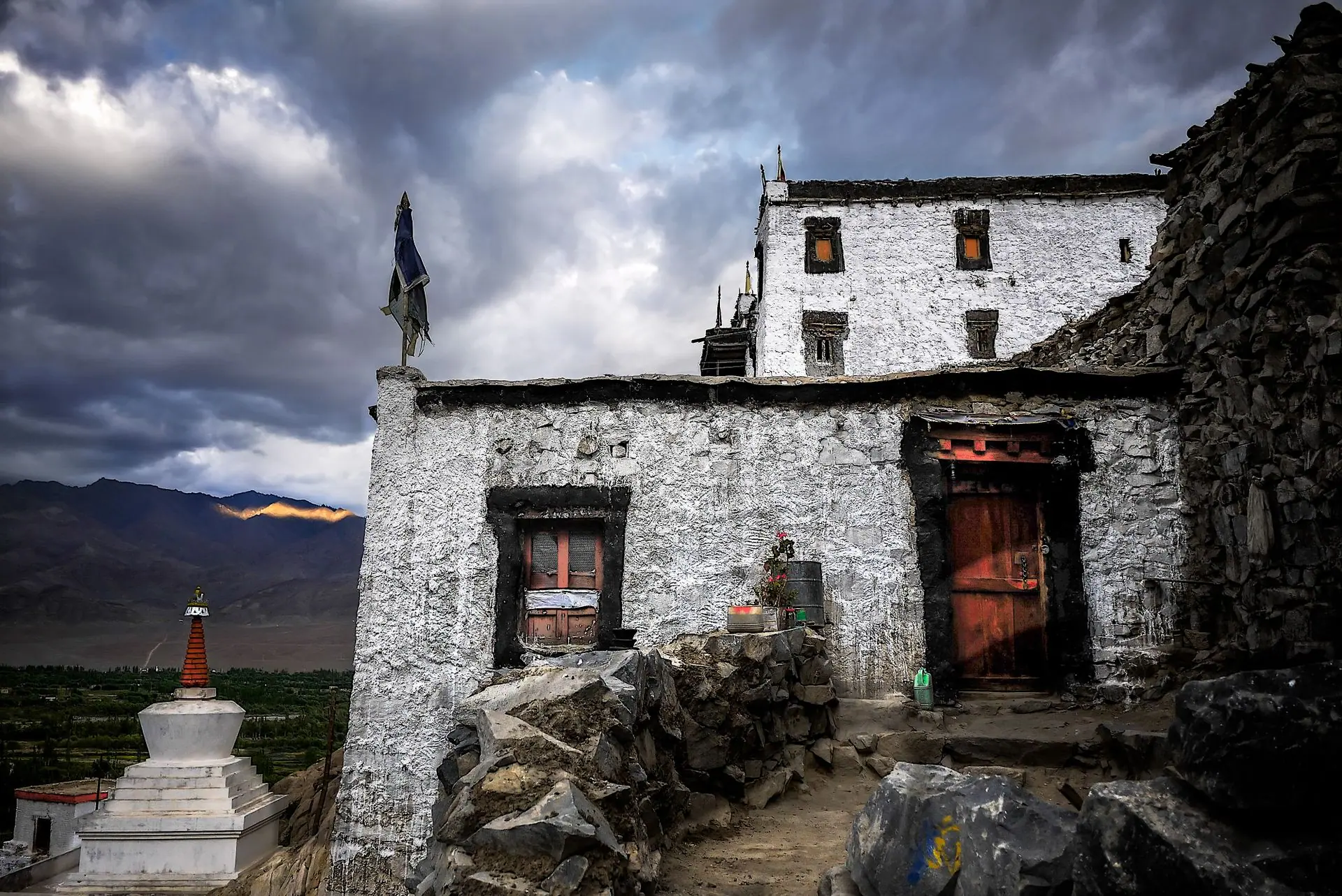 Ladakh monastery with rugged architecture and dramatic skies, evoking rich cultural heritage