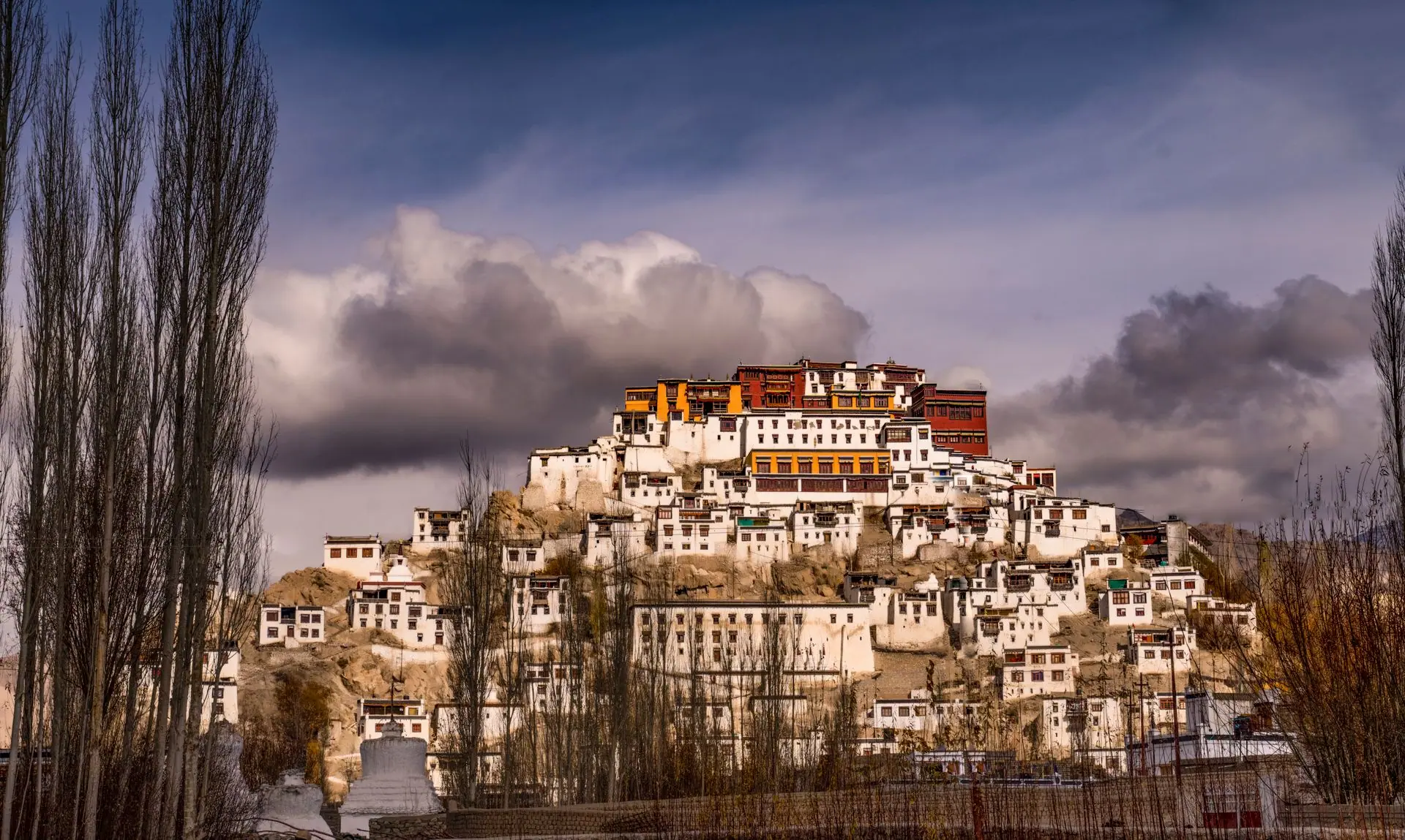 Stunning view of Thiksey Monastery under dramatic clouds in Leh, India