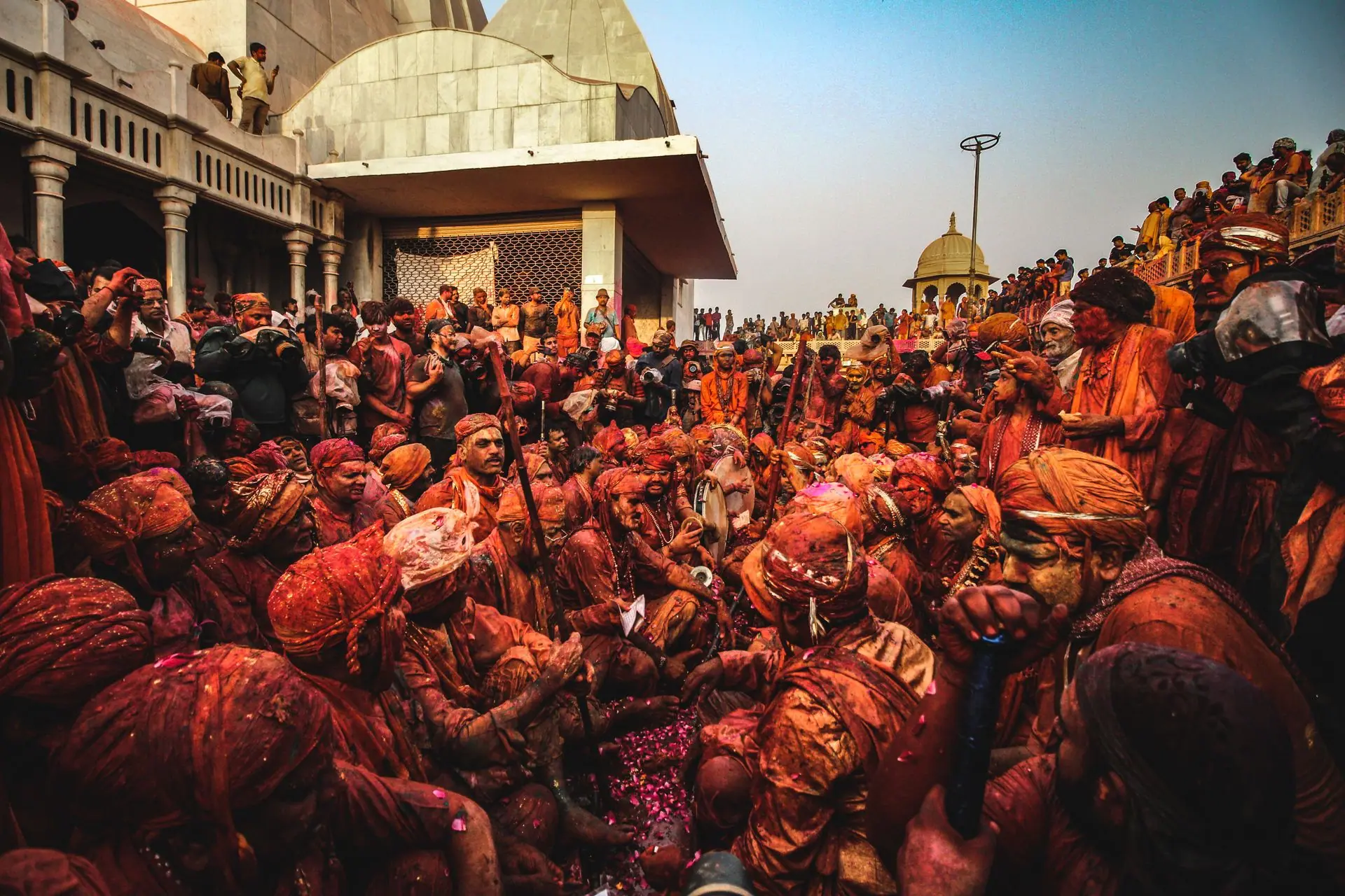 Vibrant celebration of Holi in India with colorful powders and traditional attire