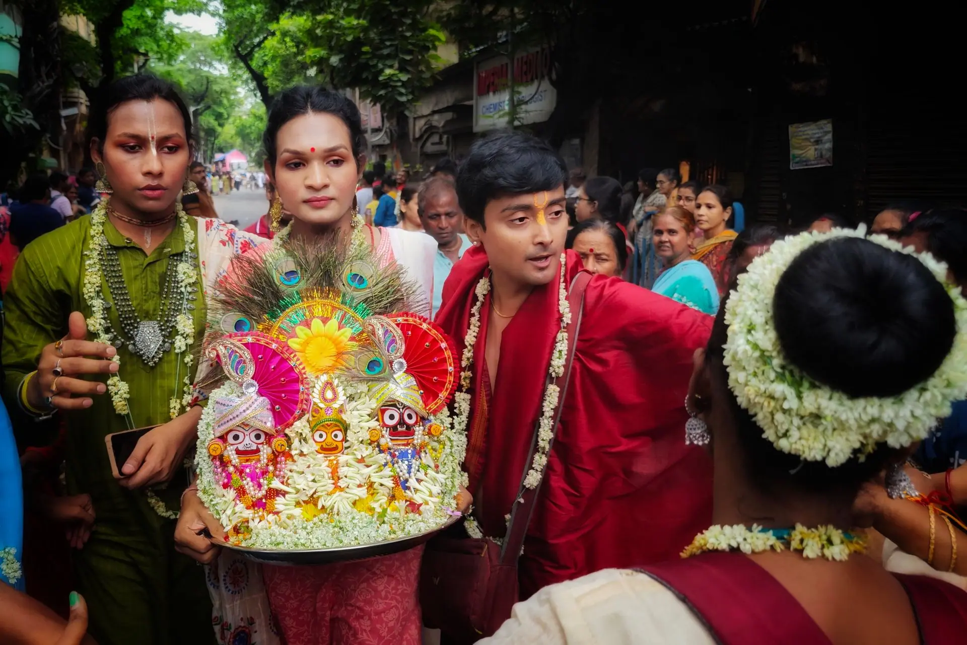 Colourful Rath Yatra festival with participants and traditional attire in Kolkata, India