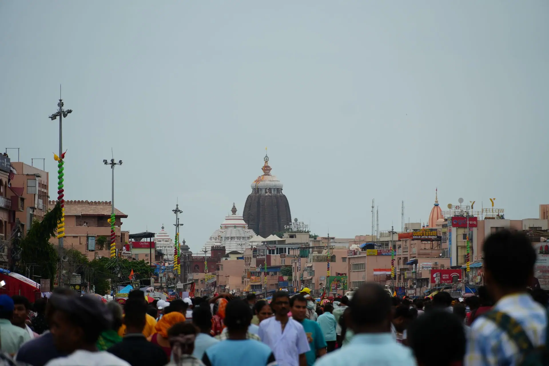 A crowded street near the iconic Jagannath Temple in Puri captures vibrant cultural life