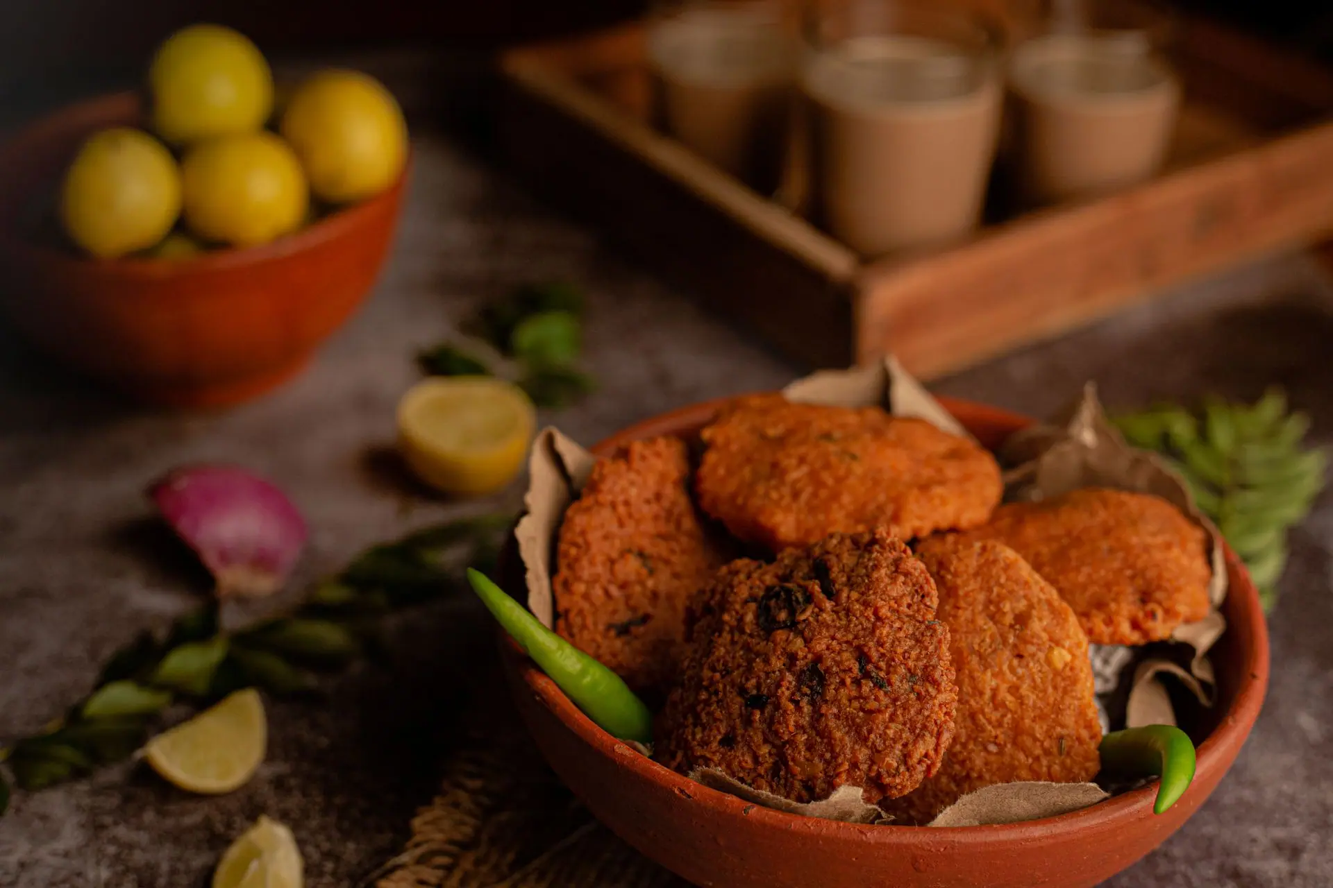 Close-up of crispy South Indian vadai served with fresh chutneys, perfect for an authentic meal