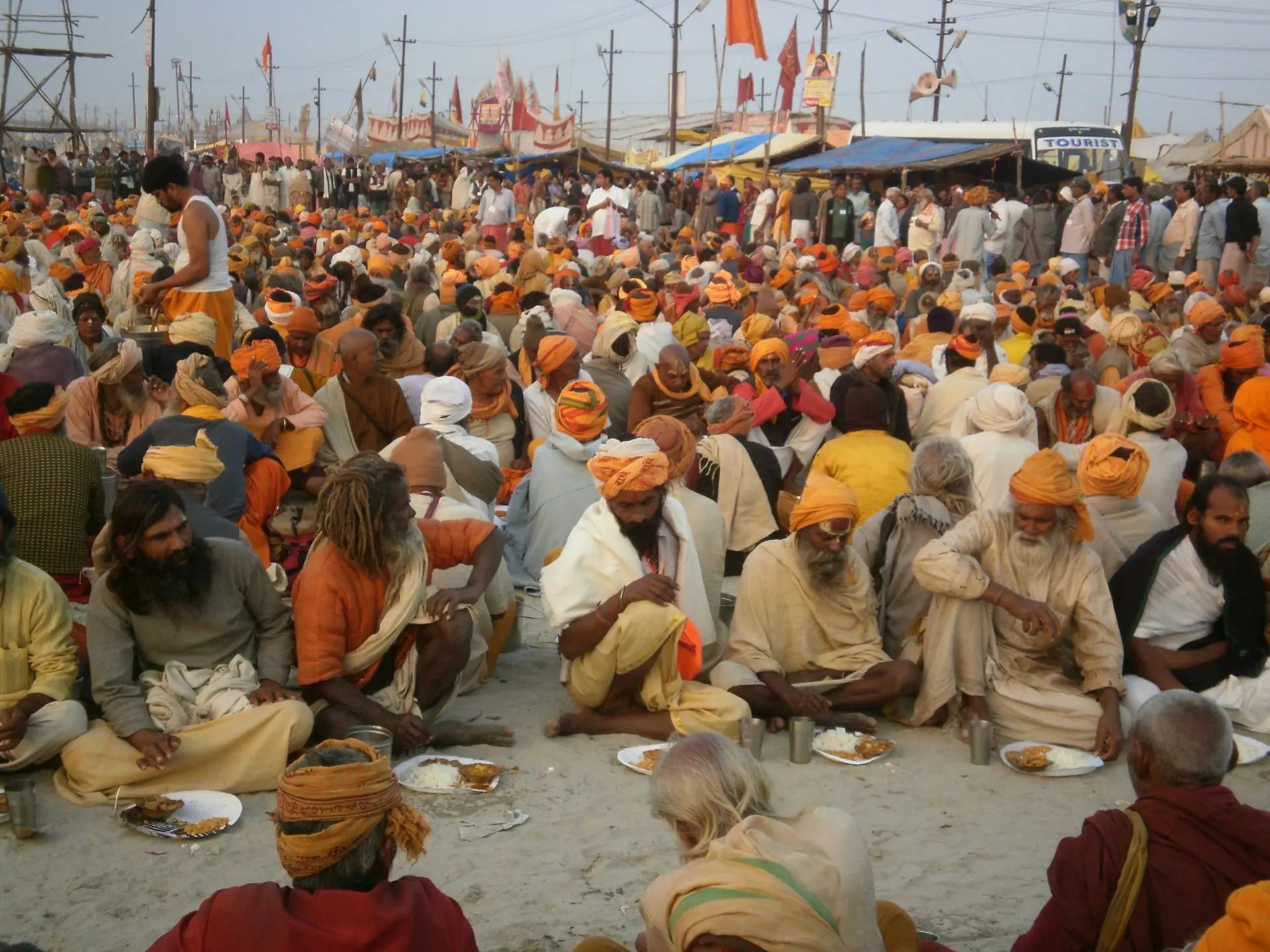 A vibrant scene of pilgrims at the Kumbh Mela in Prayagraj, showcasing spirituality and traditional culture