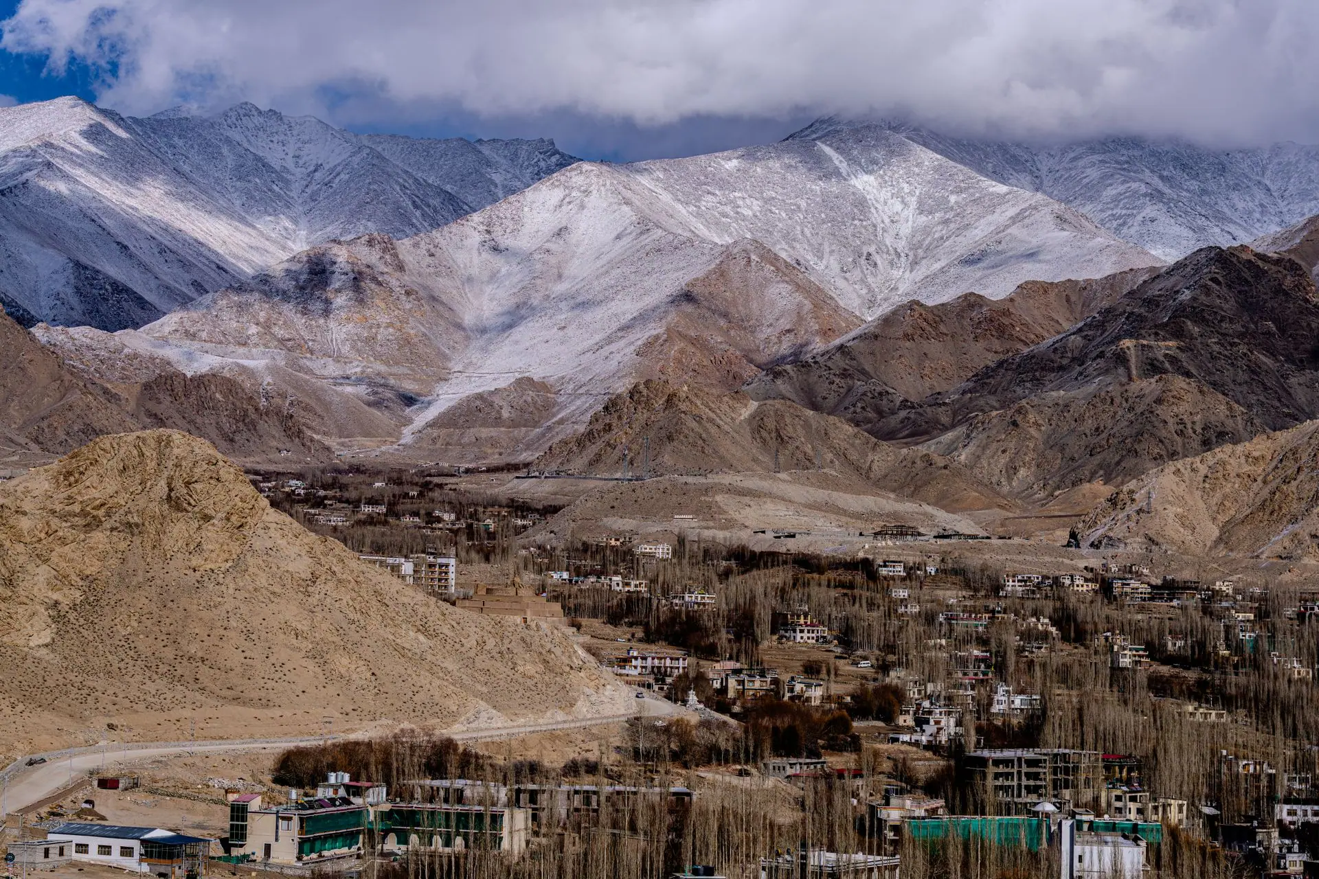 A breathtaking view of Leh city with the majestic Himalayan mountains in the background