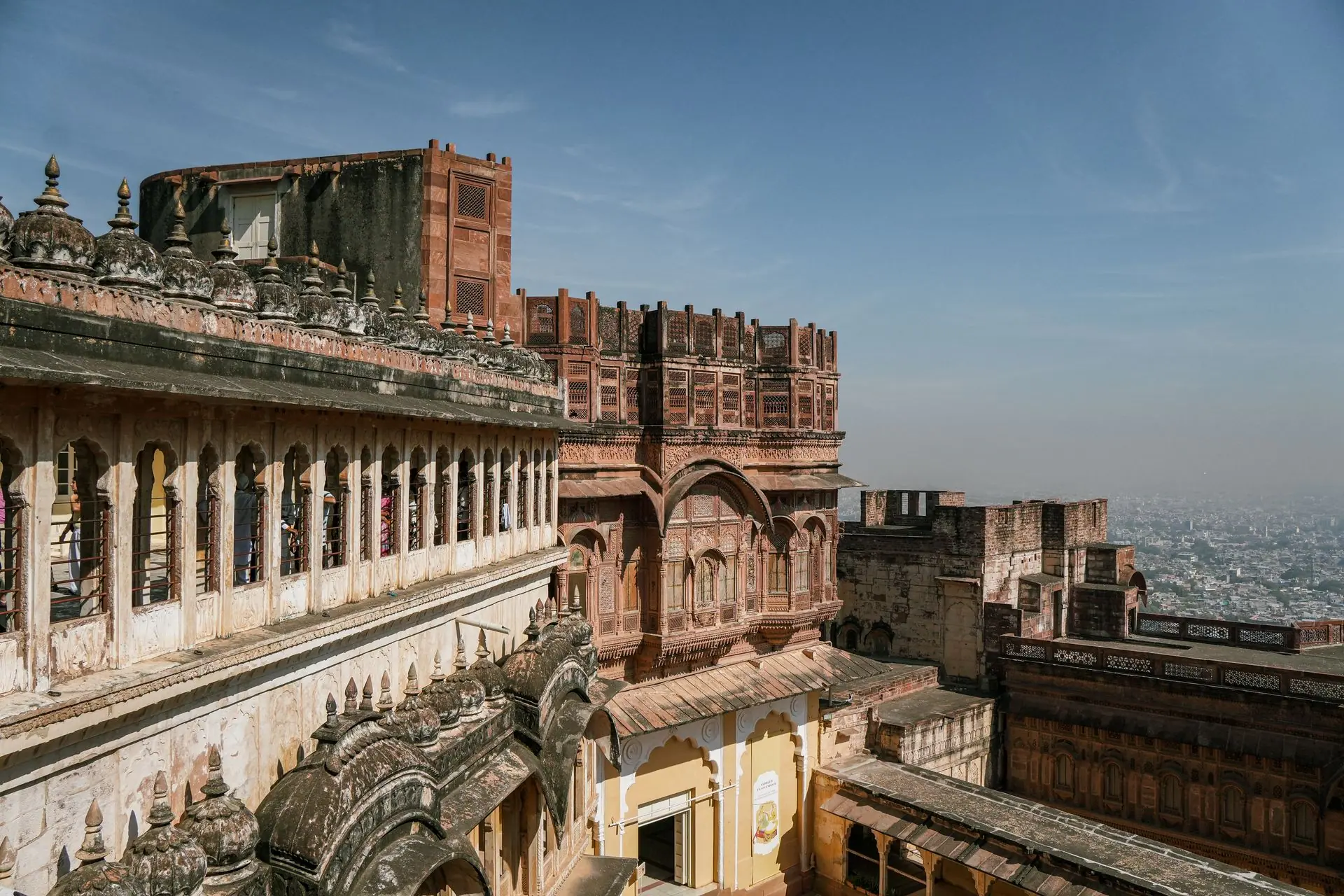 A stunning view of the historic Mehrangarh Fort in Jodhpur, showcasing its exquisite architecture against a clear sky