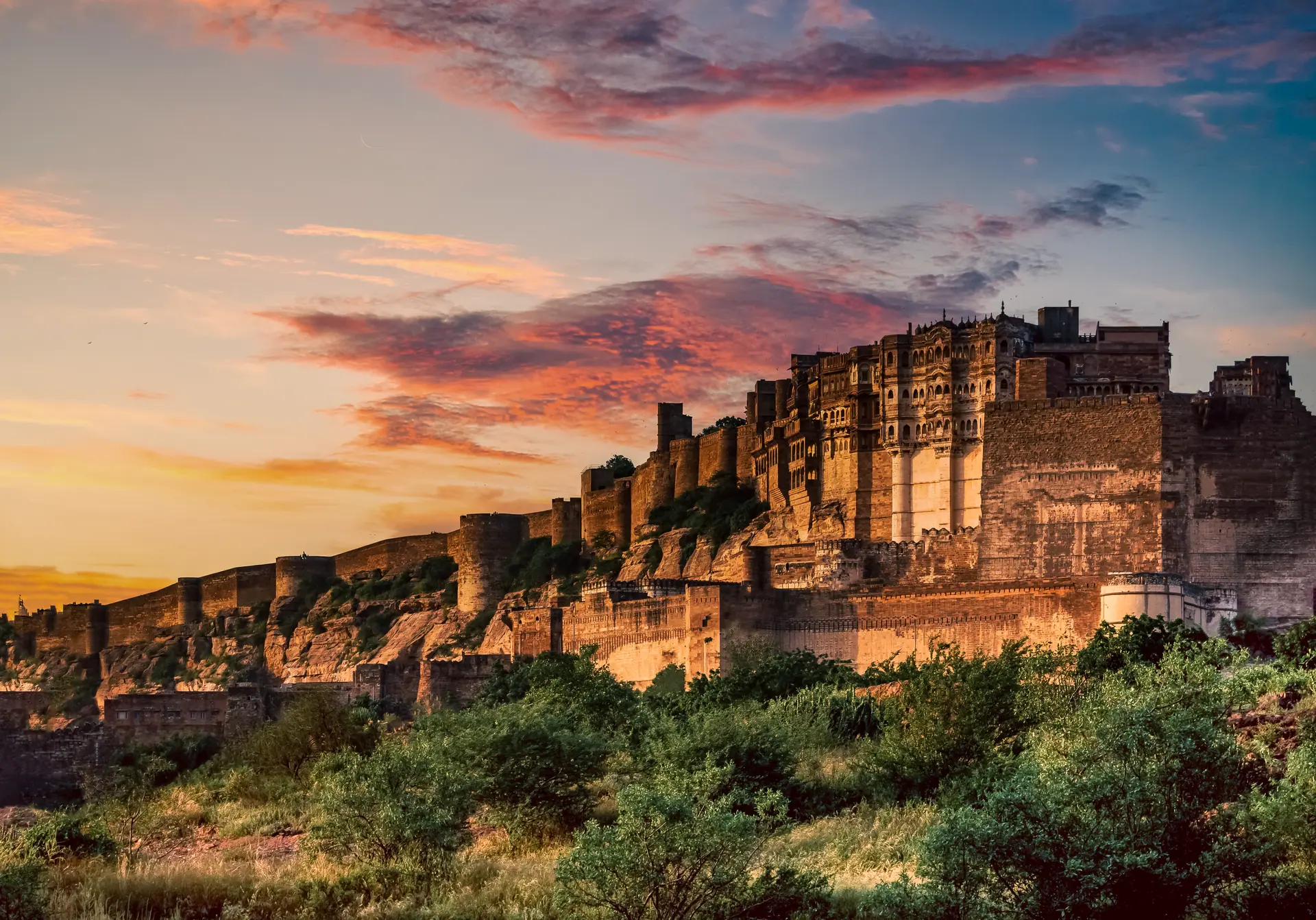 Stunning view of Mehrangarh Fort during a vibrant sunset in Jodhpur, India