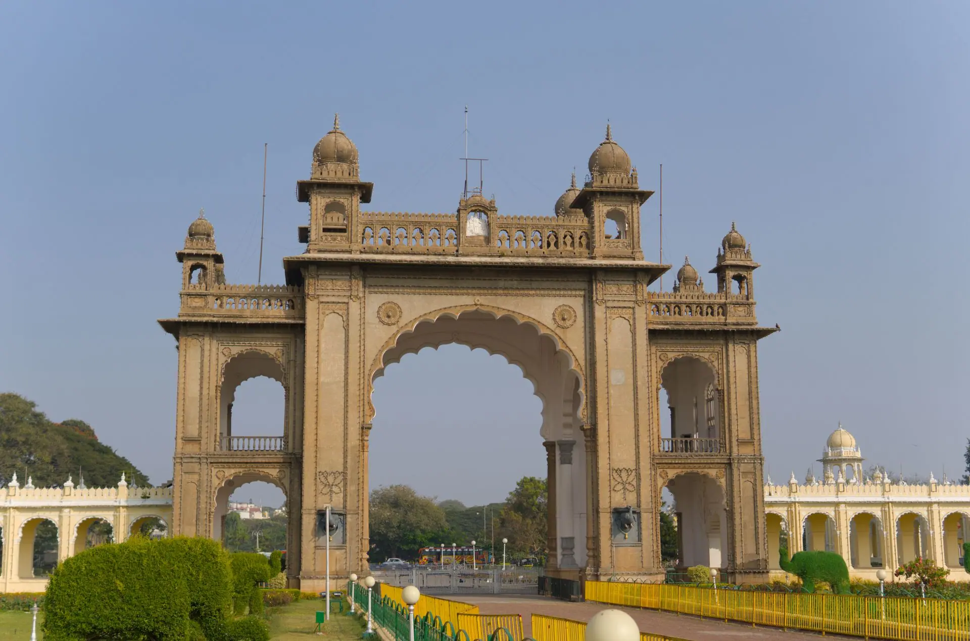 Stunning archway entrance of Mysore Palace in Karnataka, showcasing regal architecture under a clear blue sky