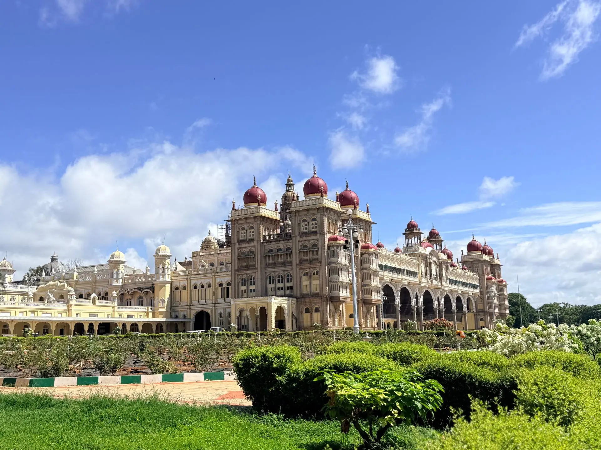 A beautiful view of the historic Mysore Palace in India under a bright blue sky
