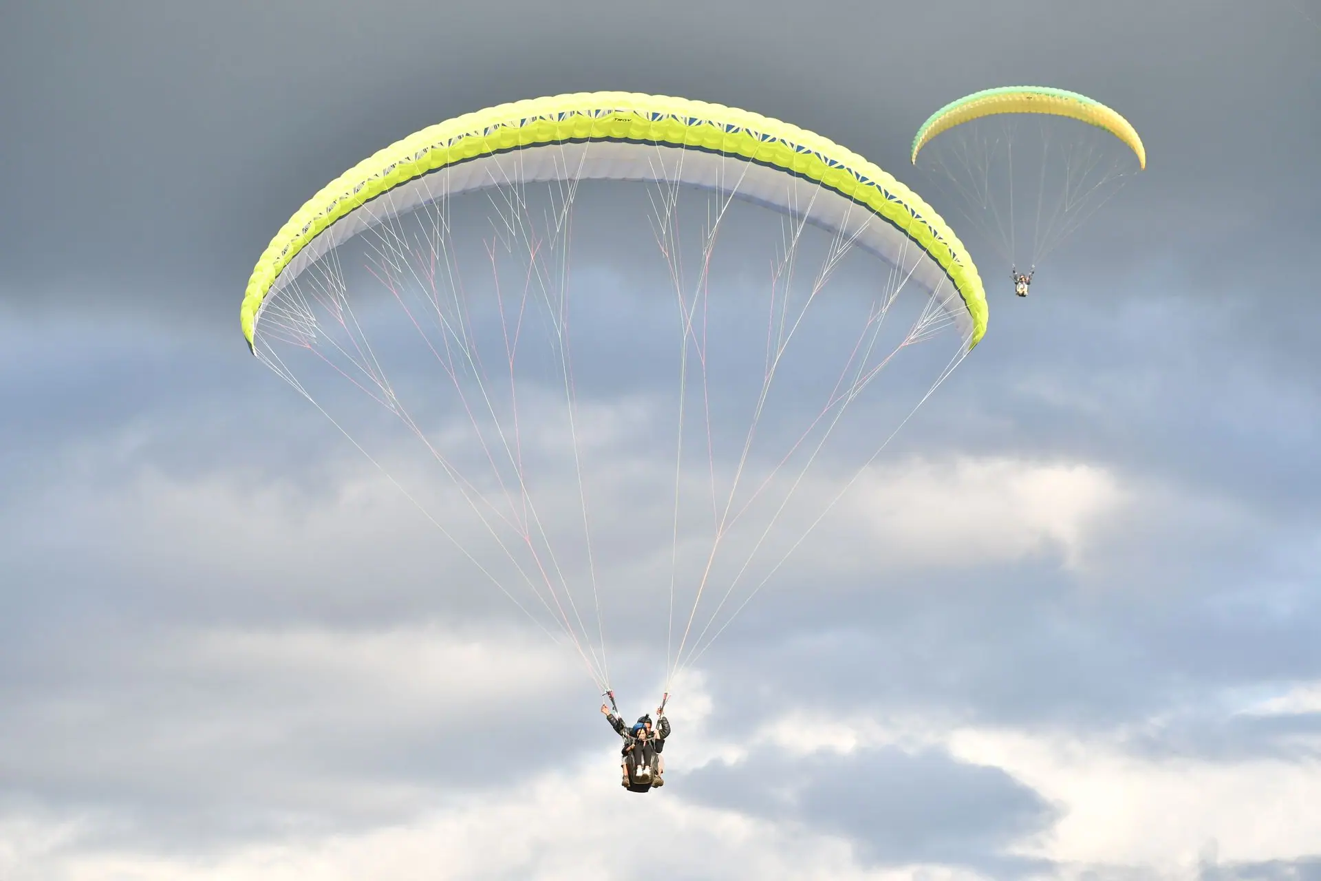 Paragliders soar above Bir in Himachal Pradesh, India on a thrilling adventure