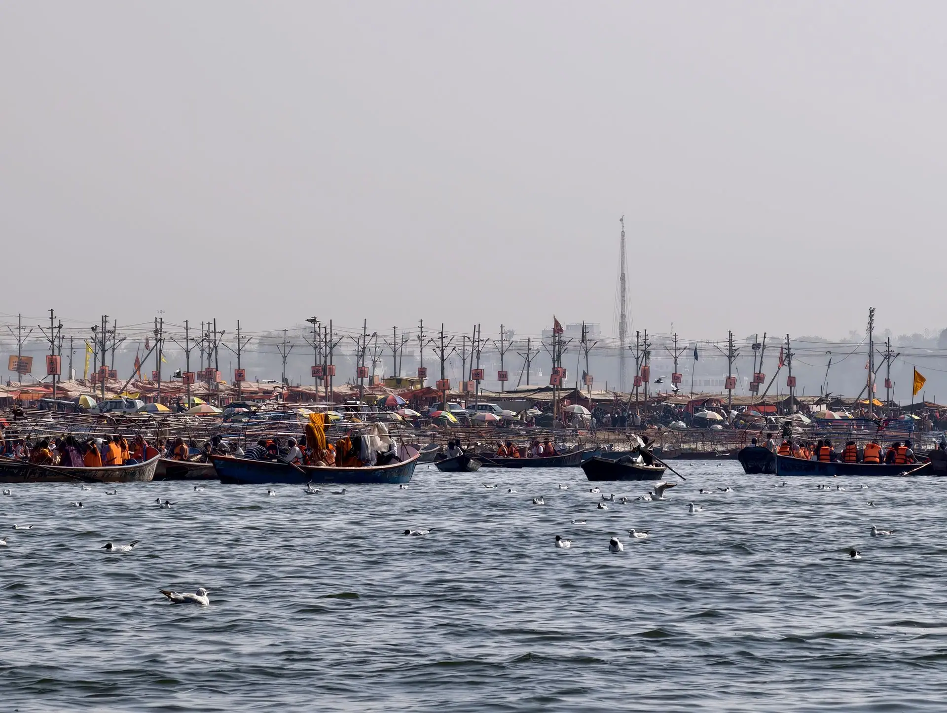 A vibrant scene of boats on the Ganges amidst Kumbh Mela festivities in Prayagraj, India