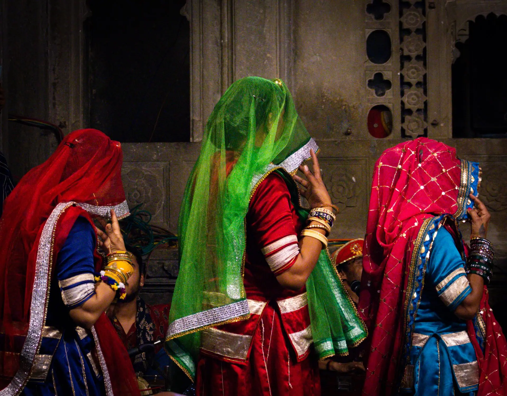 Traditional Rajasthani dancers in colorful attire performing a folk dance in Udaipur, India