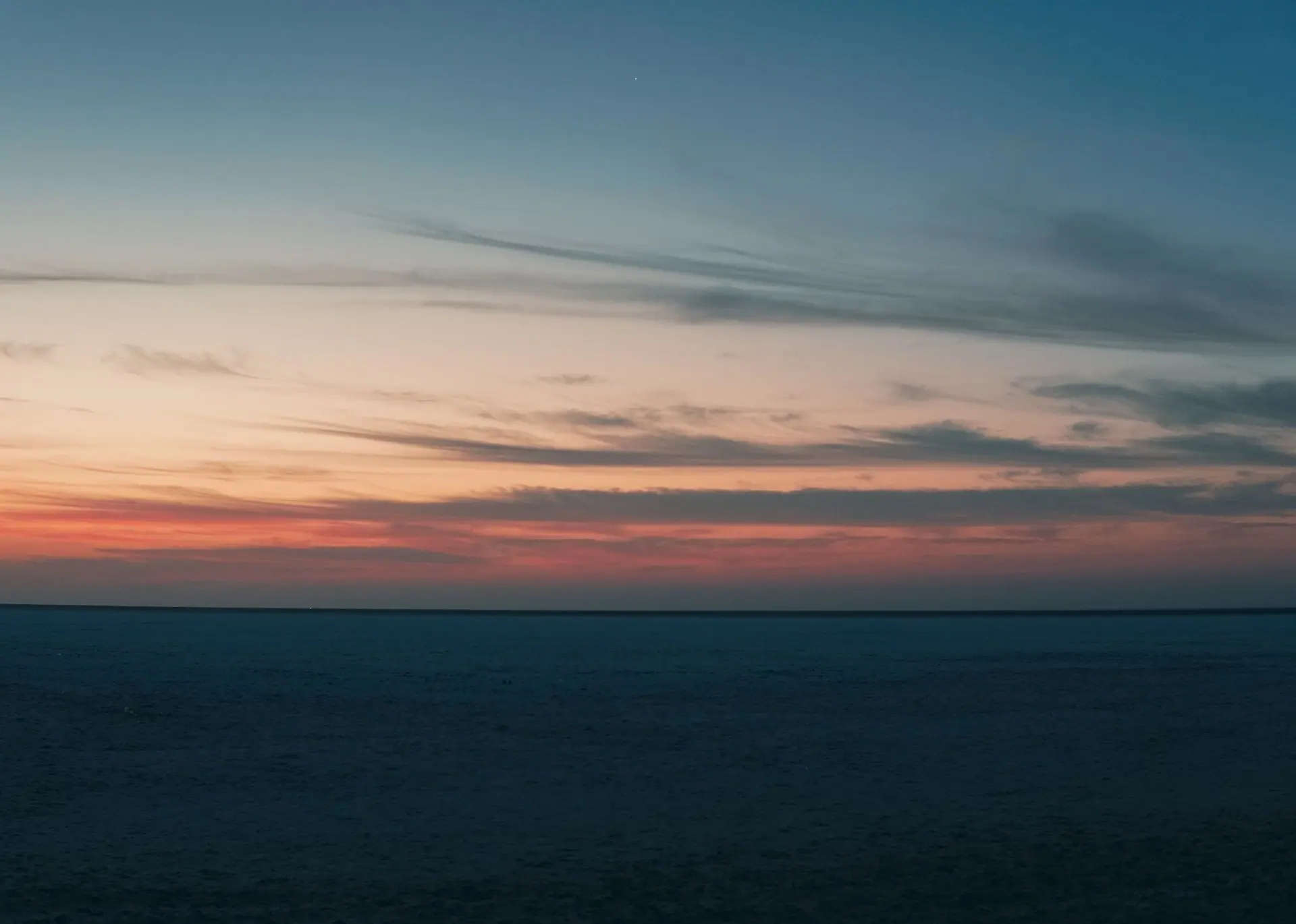 Breathtaking sunset view over the Rann of Kutch, capturing the tranquil dusk sky