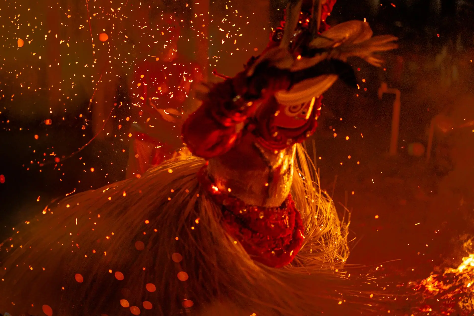 A captivating Theyyam fire dance ritual at night in Kannur, Kerala, showcasing vibrant traditional attire
