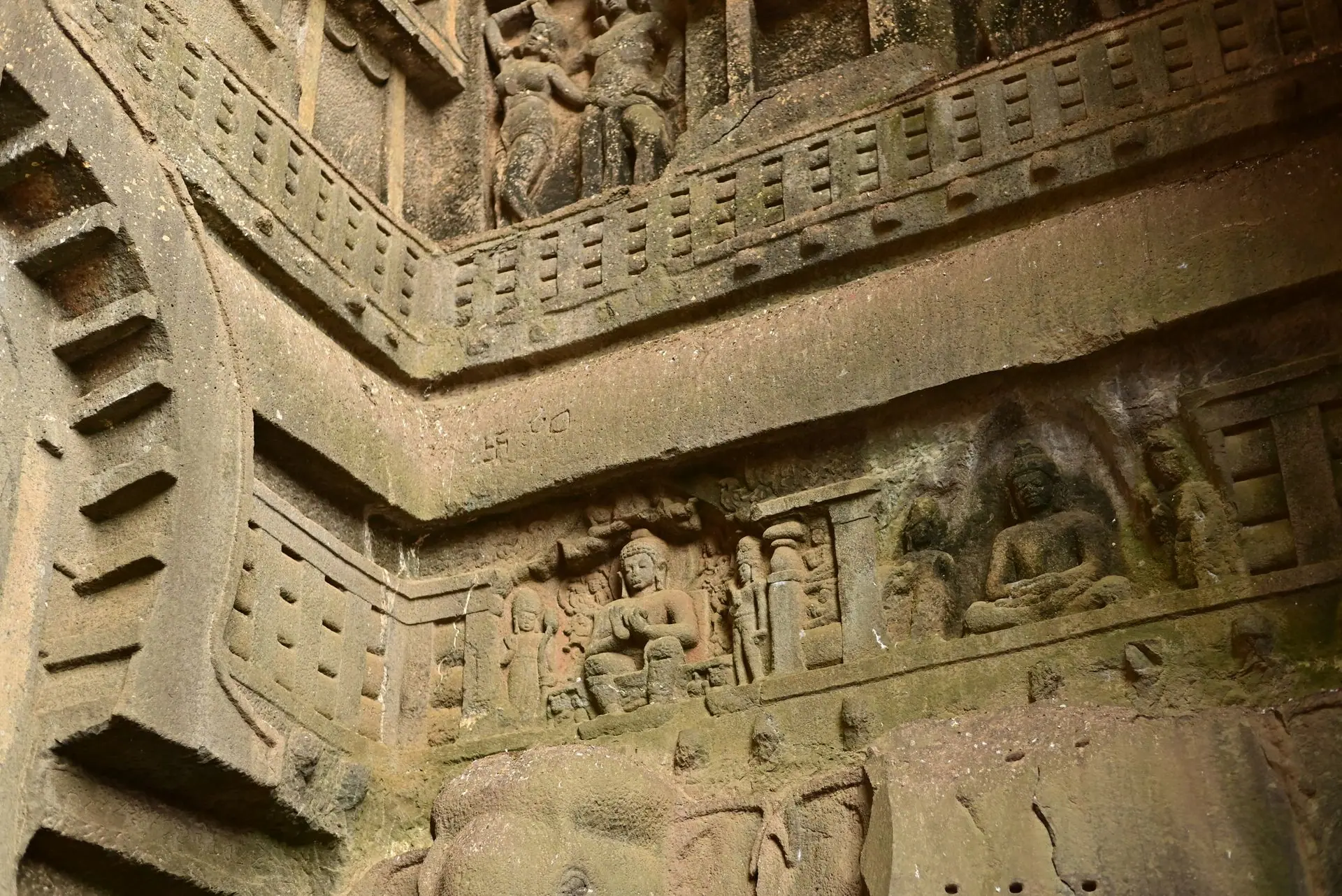 Detailed view of ancient Buddhist rock carvings and architecture in Lonavala, India