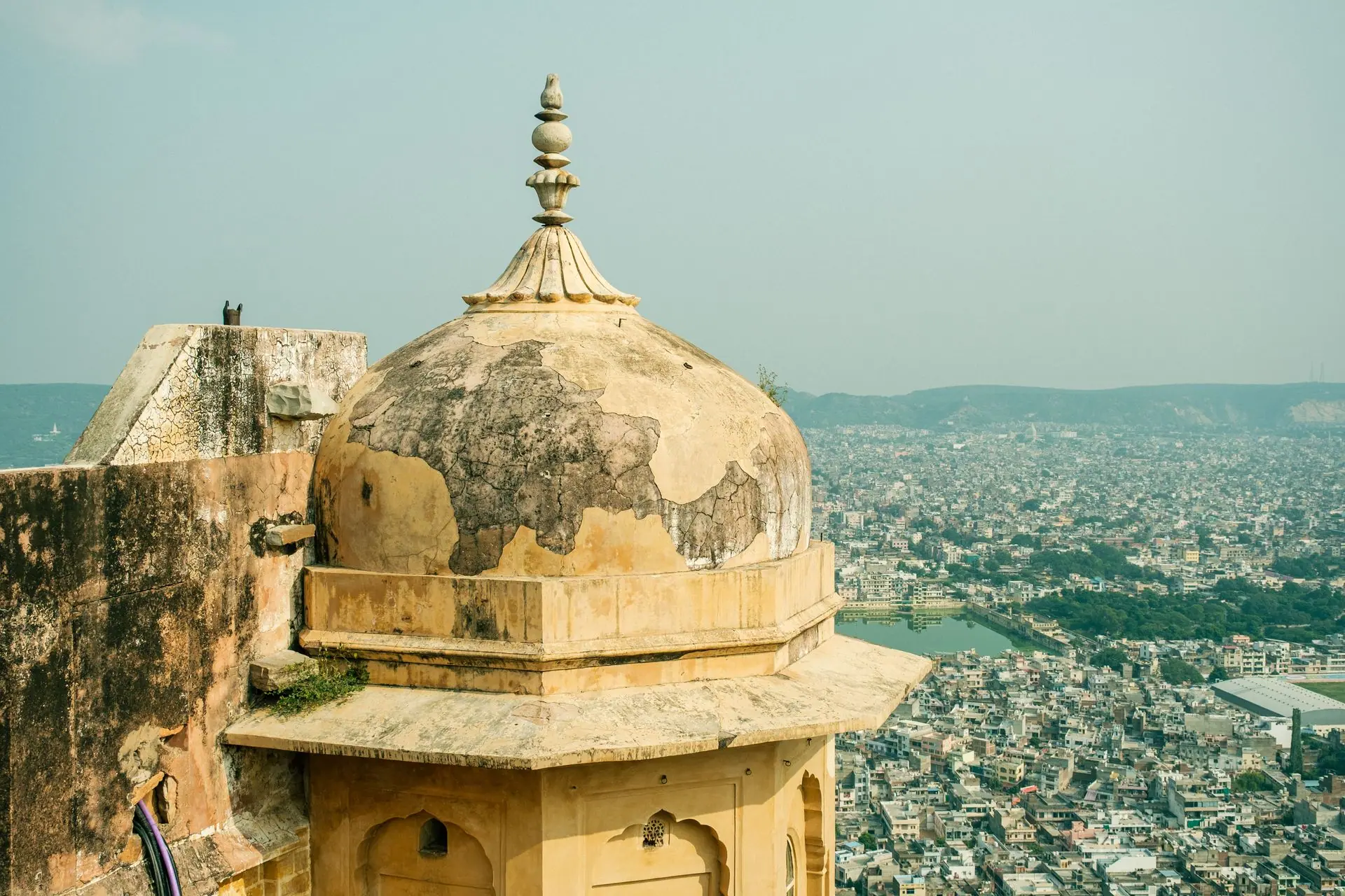 A historic dome in Jaipur offering a panoramic view of the bustling cityscape