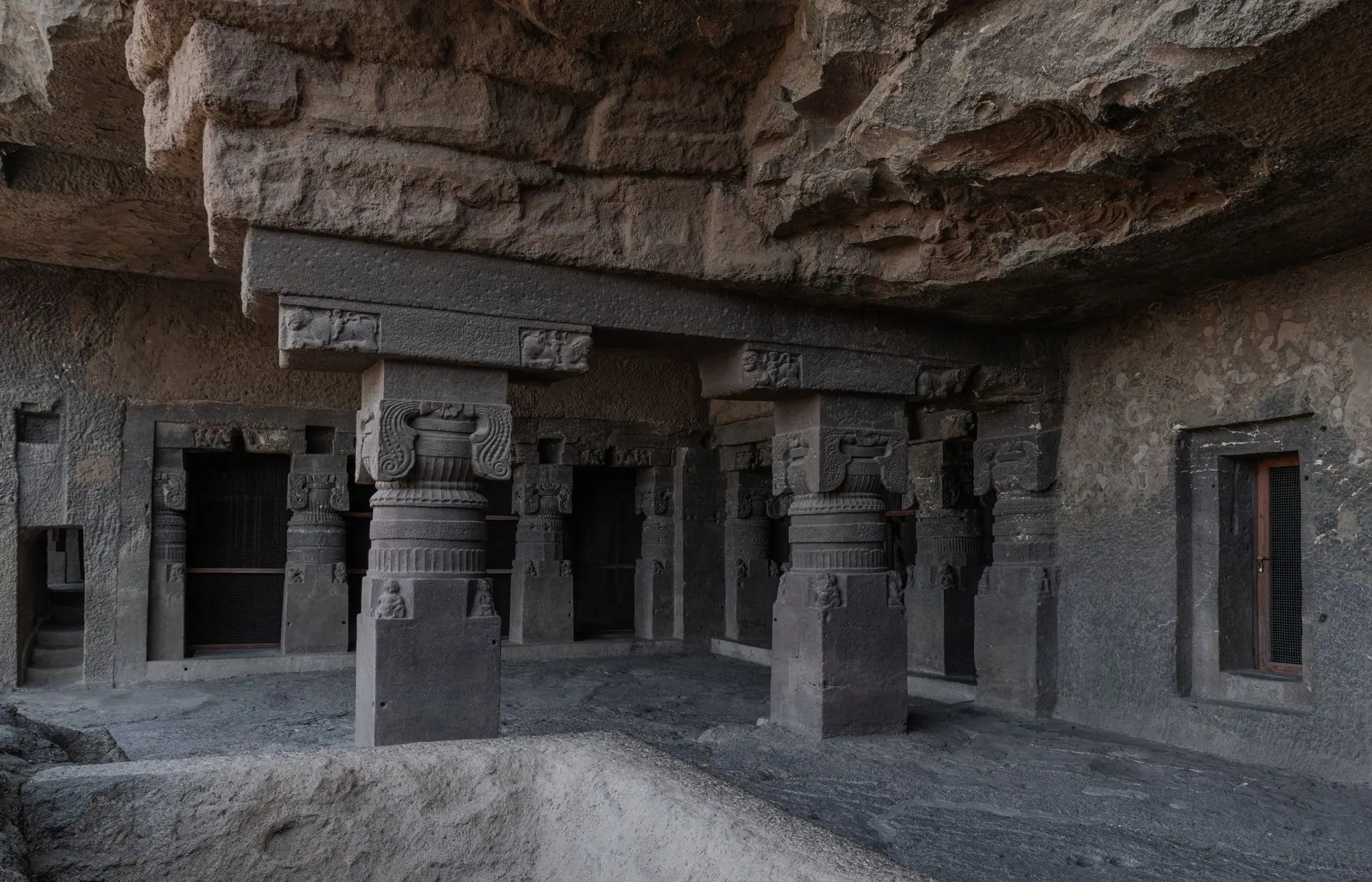 Explore the intricate stone carvings and pillars of the ancient Ellora Caves, Maharashtra, India