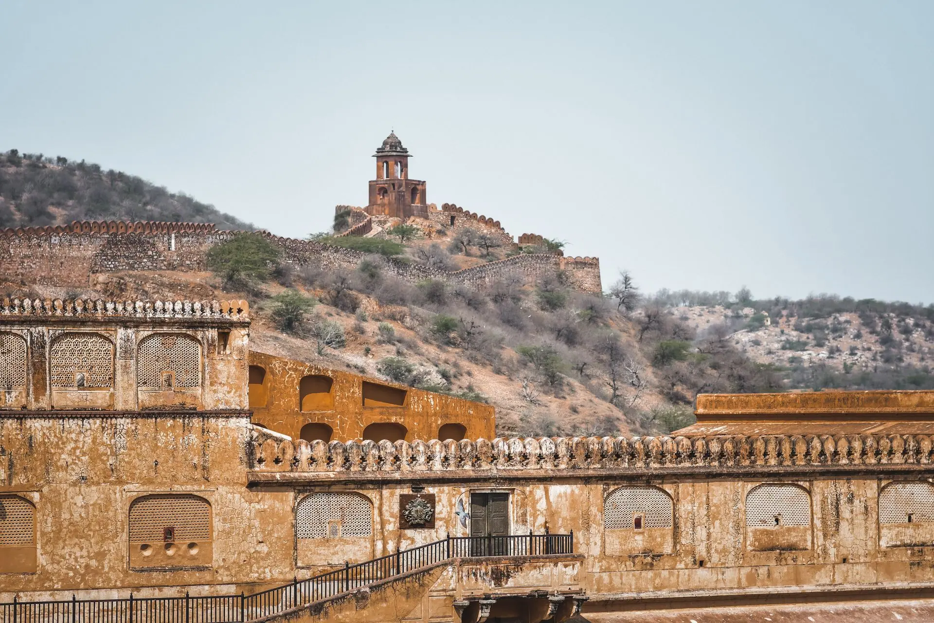 Explore the majestic Amber Fort set against the arid Aravalli hills in Jaipur, India