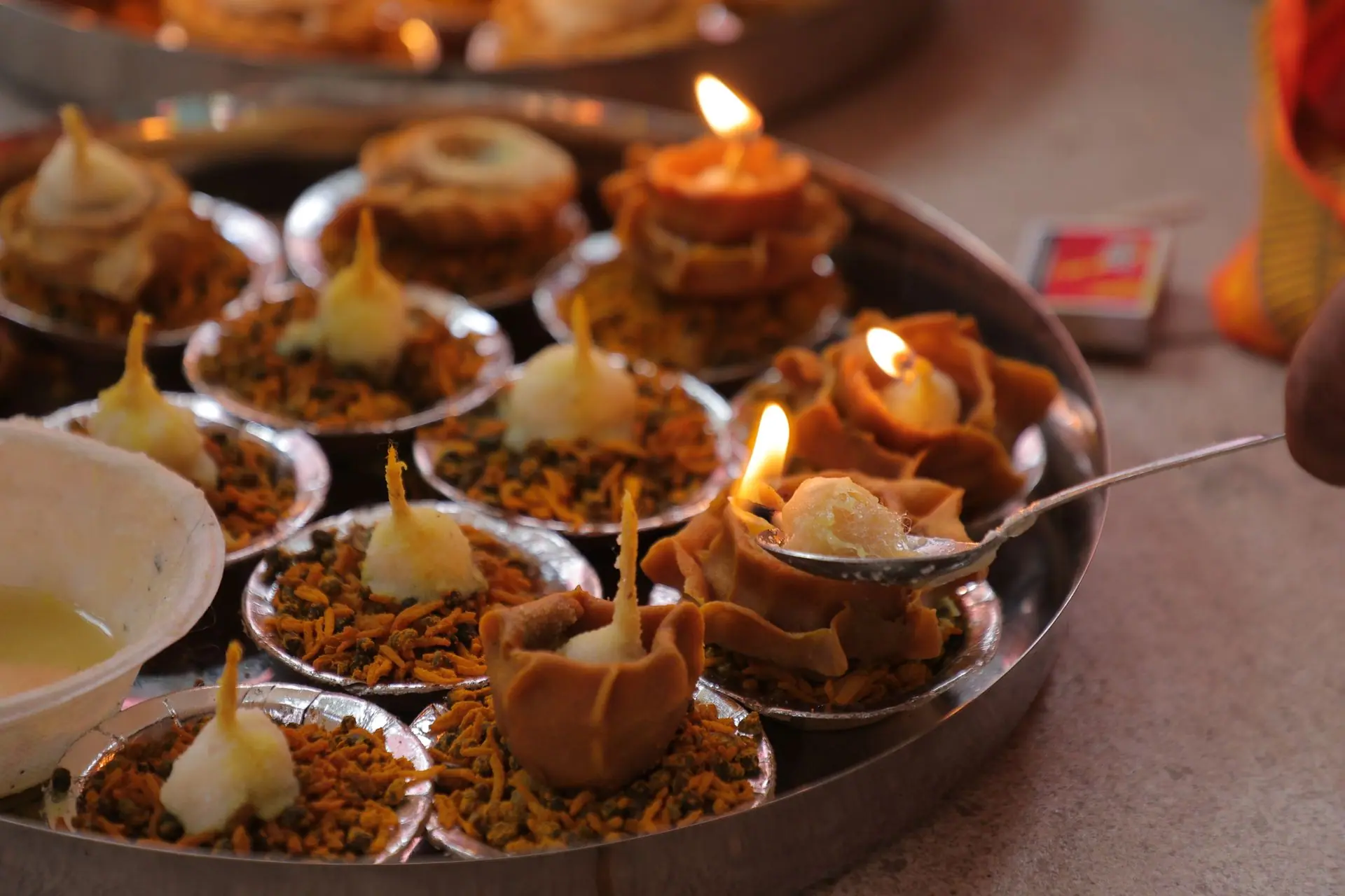 A collection of traditional Indian diyas lit and beautifully arranged for a festive occasion