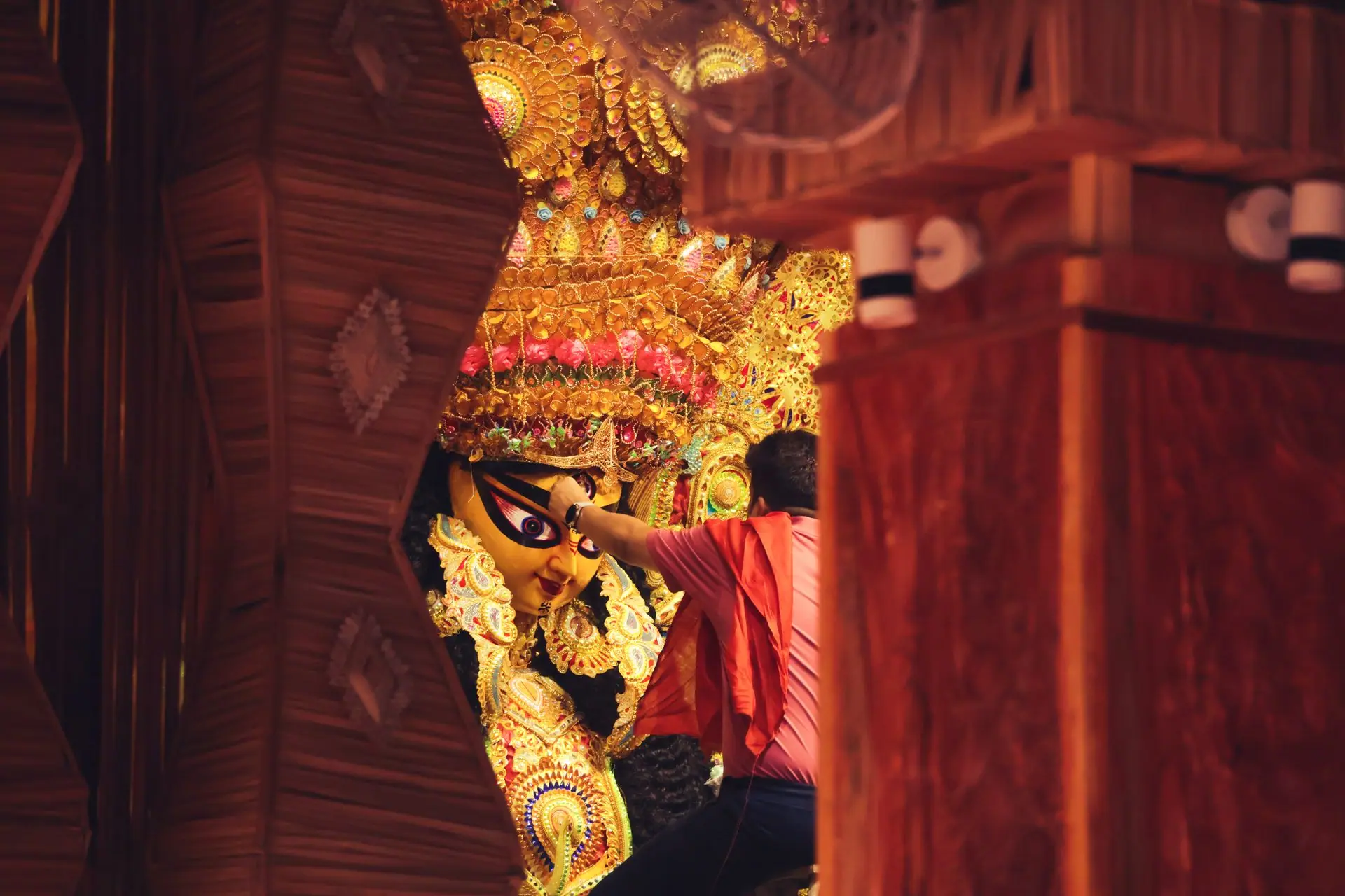 Man performing ritual during Durga Puja in Kolkata, highlighting Hindu spirituality and cultural traditions