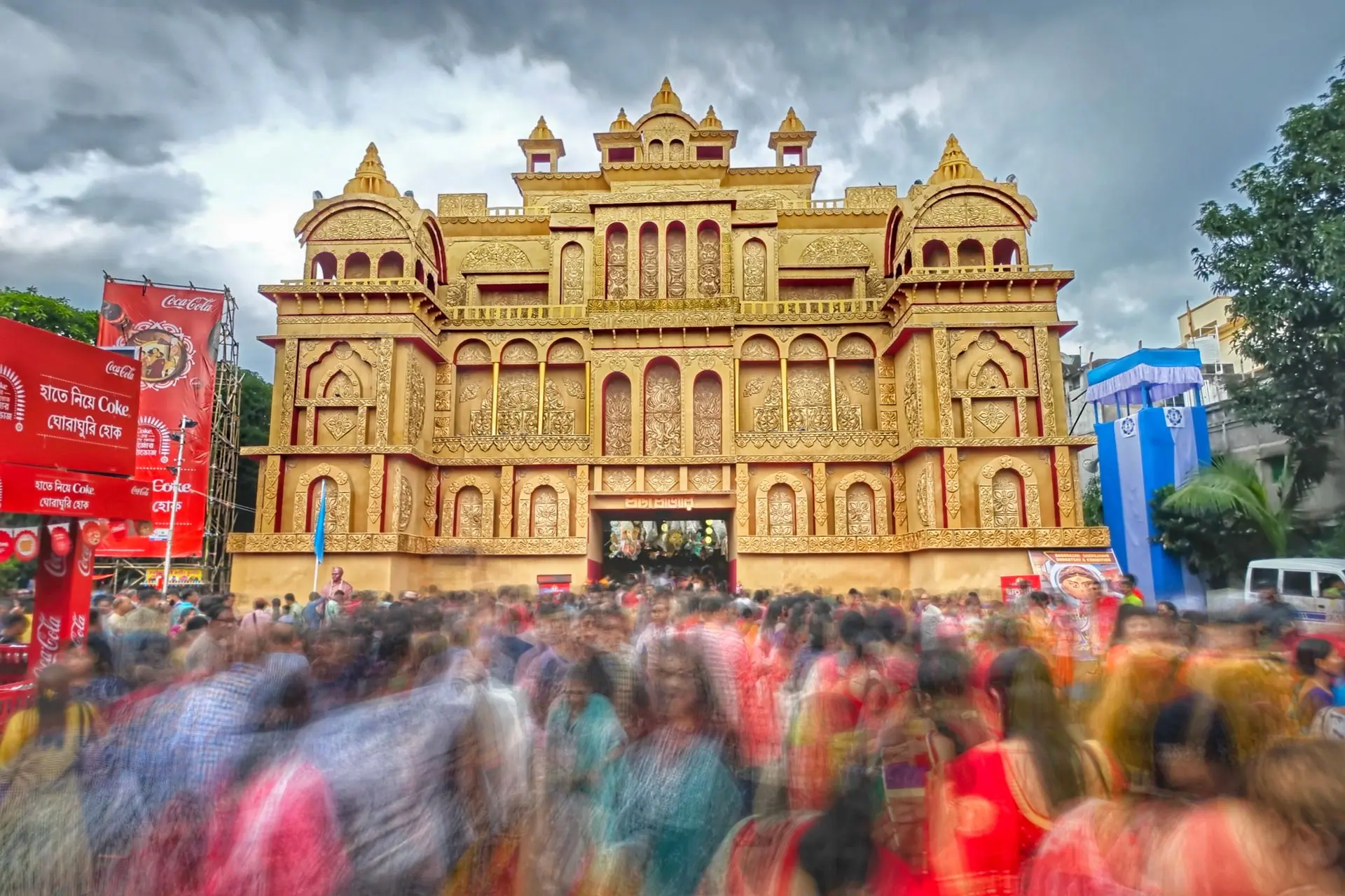 Crowds gather at a stunning Durga Puja pandal in Kolkata, India, capturing vibrant cultural celebrations