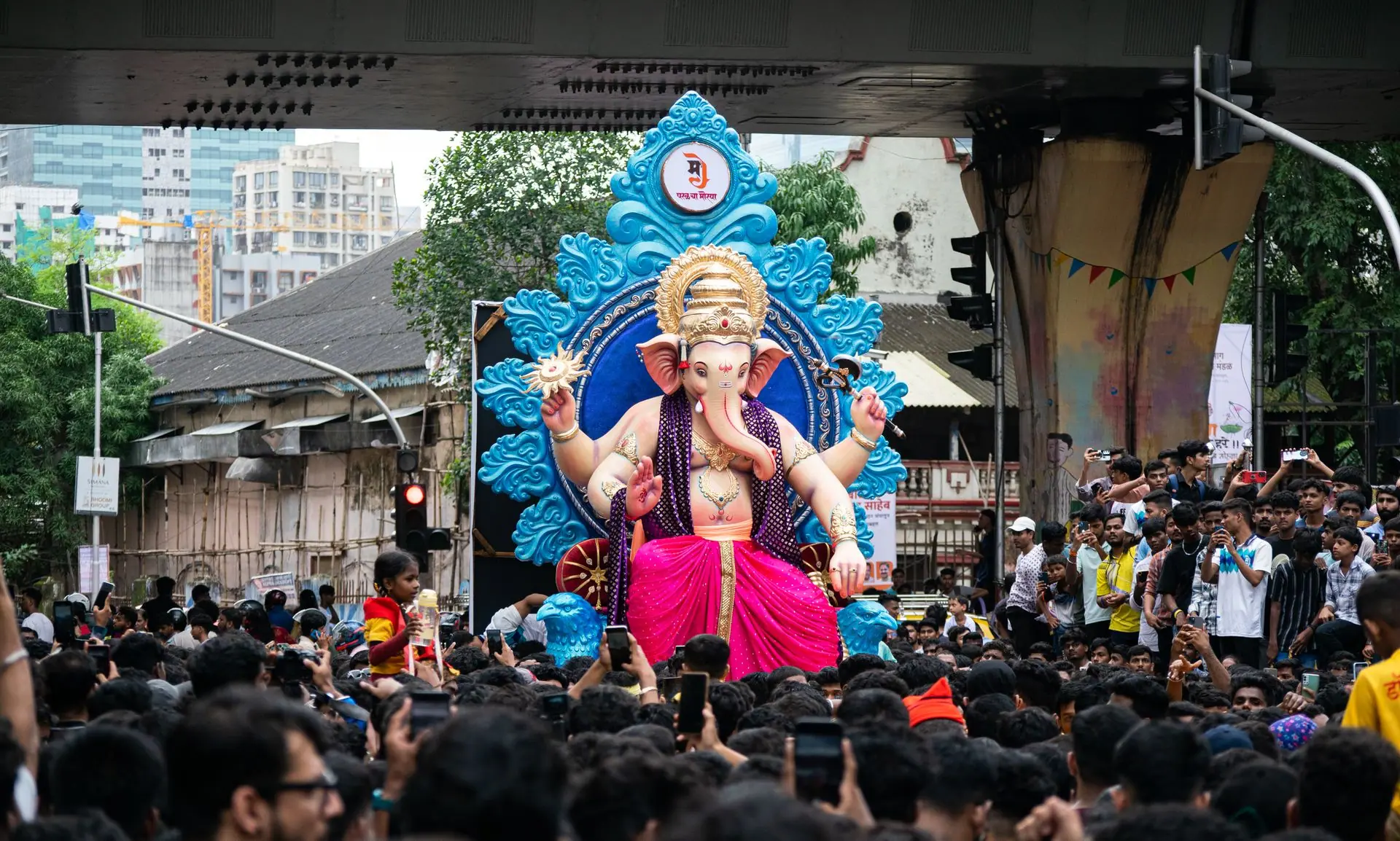 Crowds gather in Mumbai for Ganesh Chaturthi festival, celebrating with a grand parade