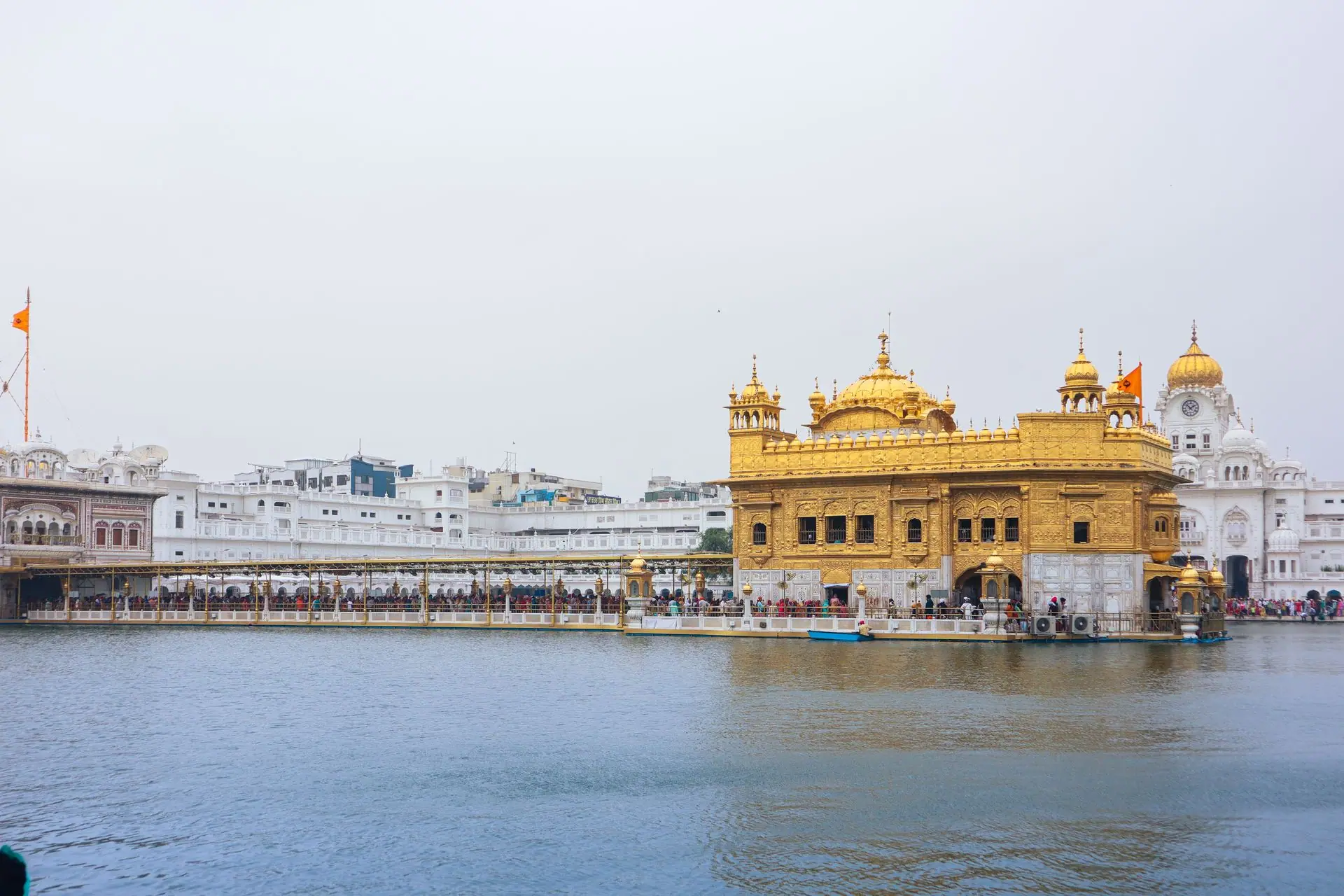 Stunning view of Golden Temple in Amritsar, India, reflected in water under a clear sky