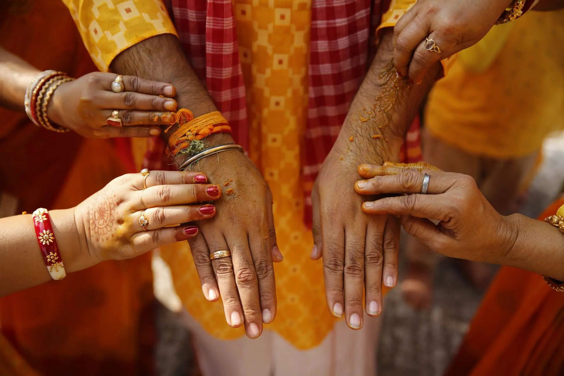 Close-up of traditional Indian wedding ritual with henna and turmeric in Kolkata, India