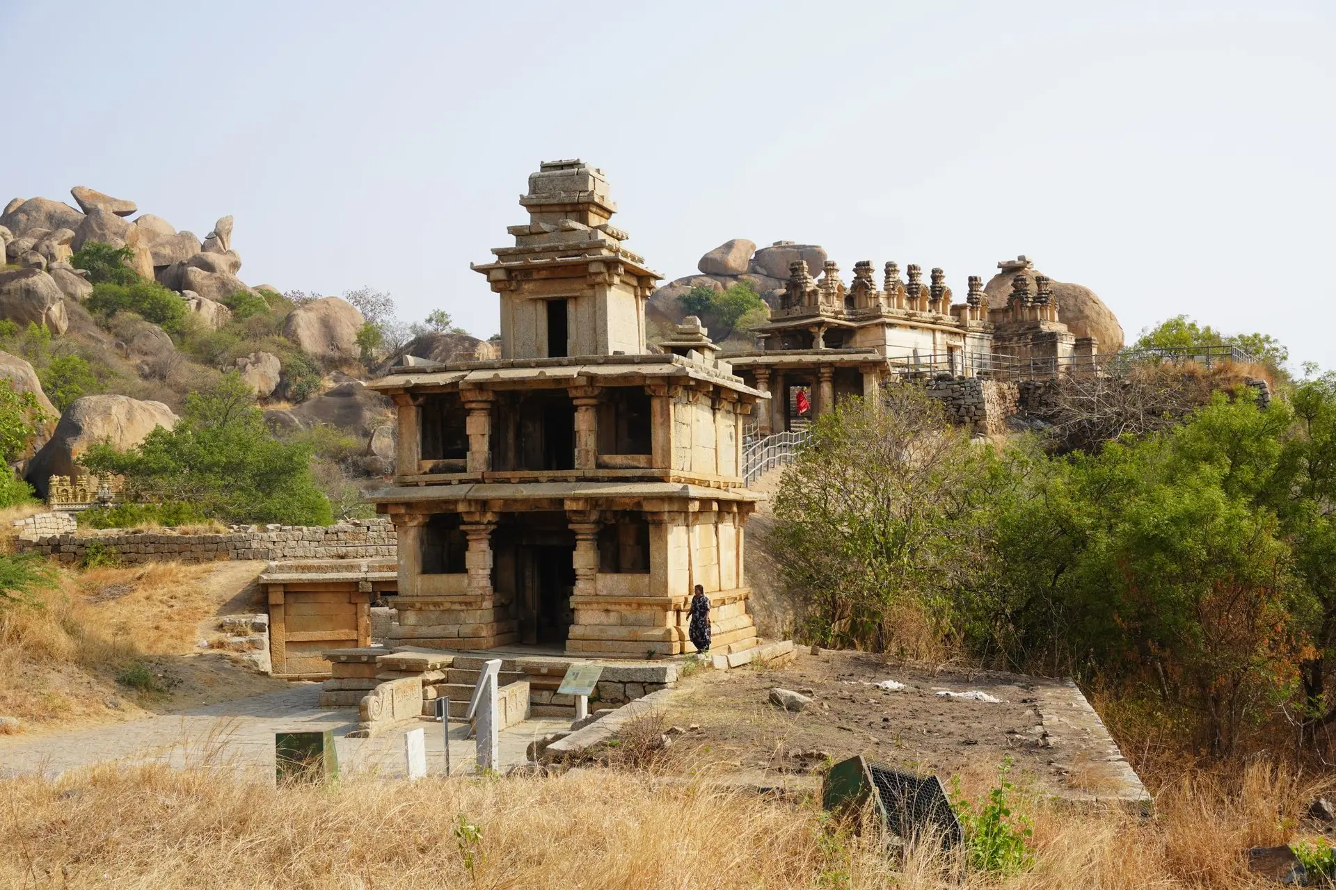 Ancient Vijaya Vittala Temple ruins in Hampi, showcasing stunning architecture and scenic landscape