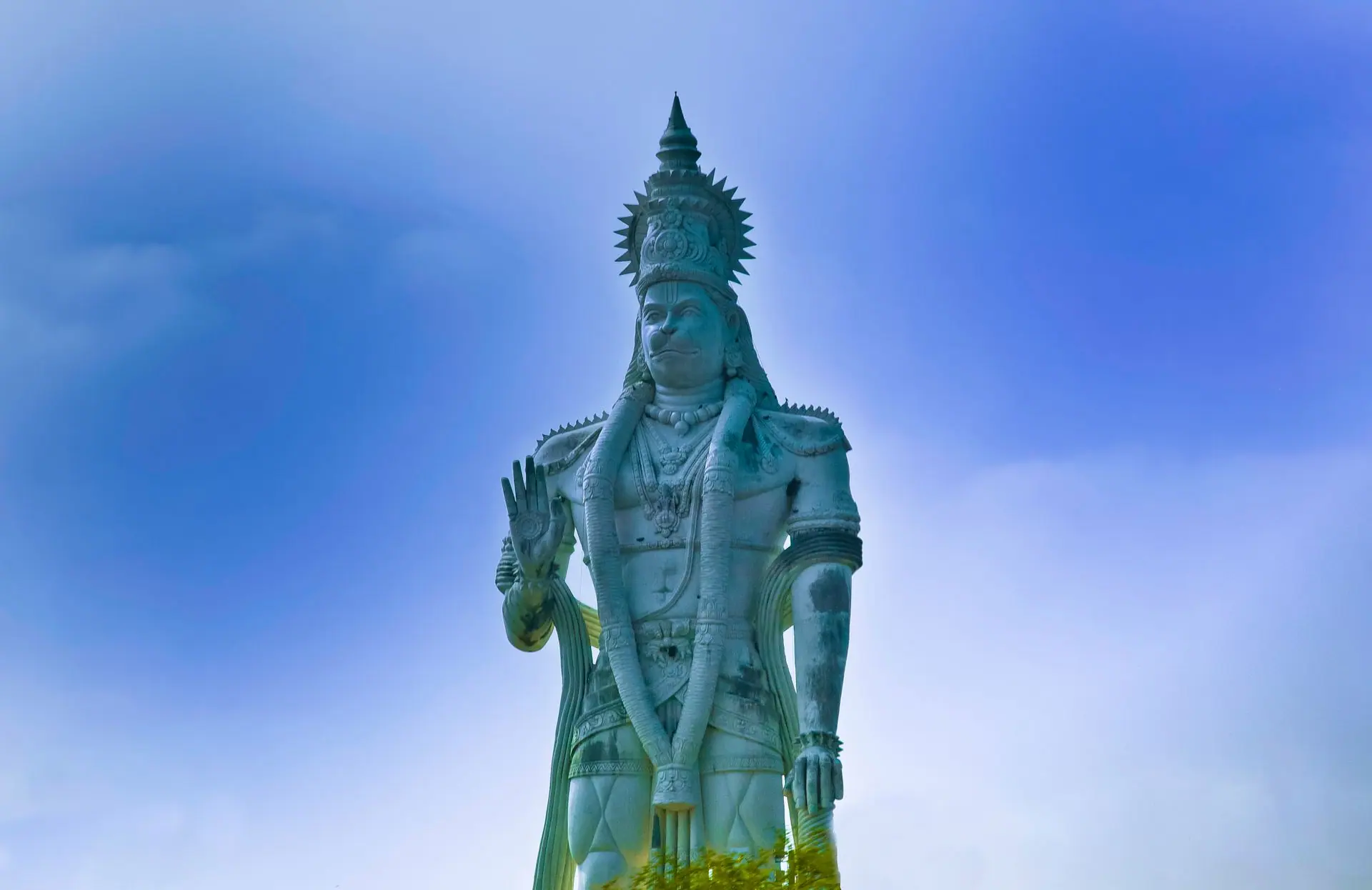 Breathtaking view of the Hanuman statue against the clear blue sky in Kanchikacherla, India