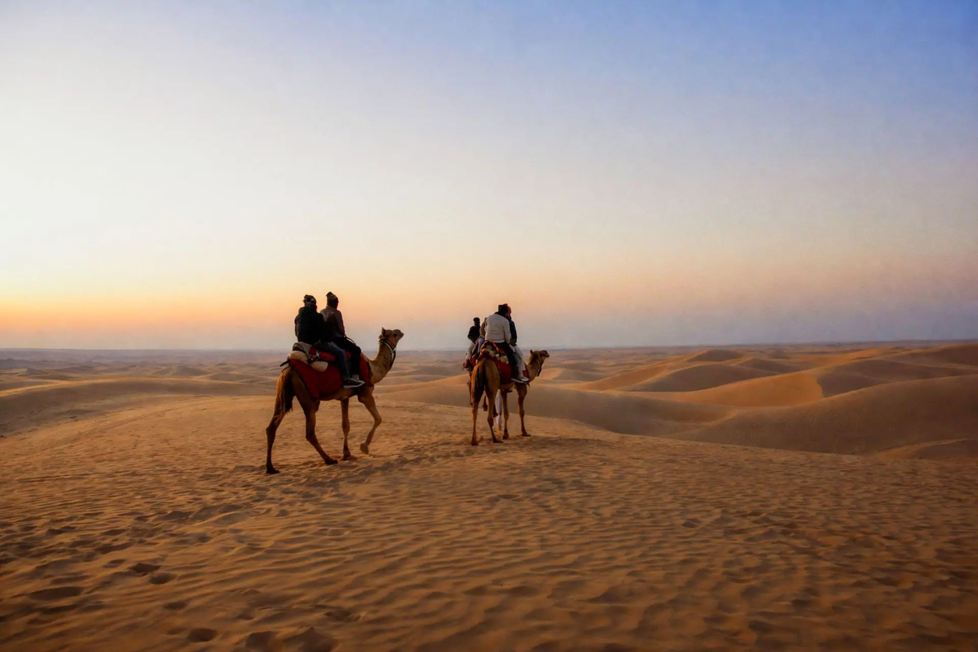 A breathtaking camel ride through the golden sand dunes of Jaisalmer at sunset