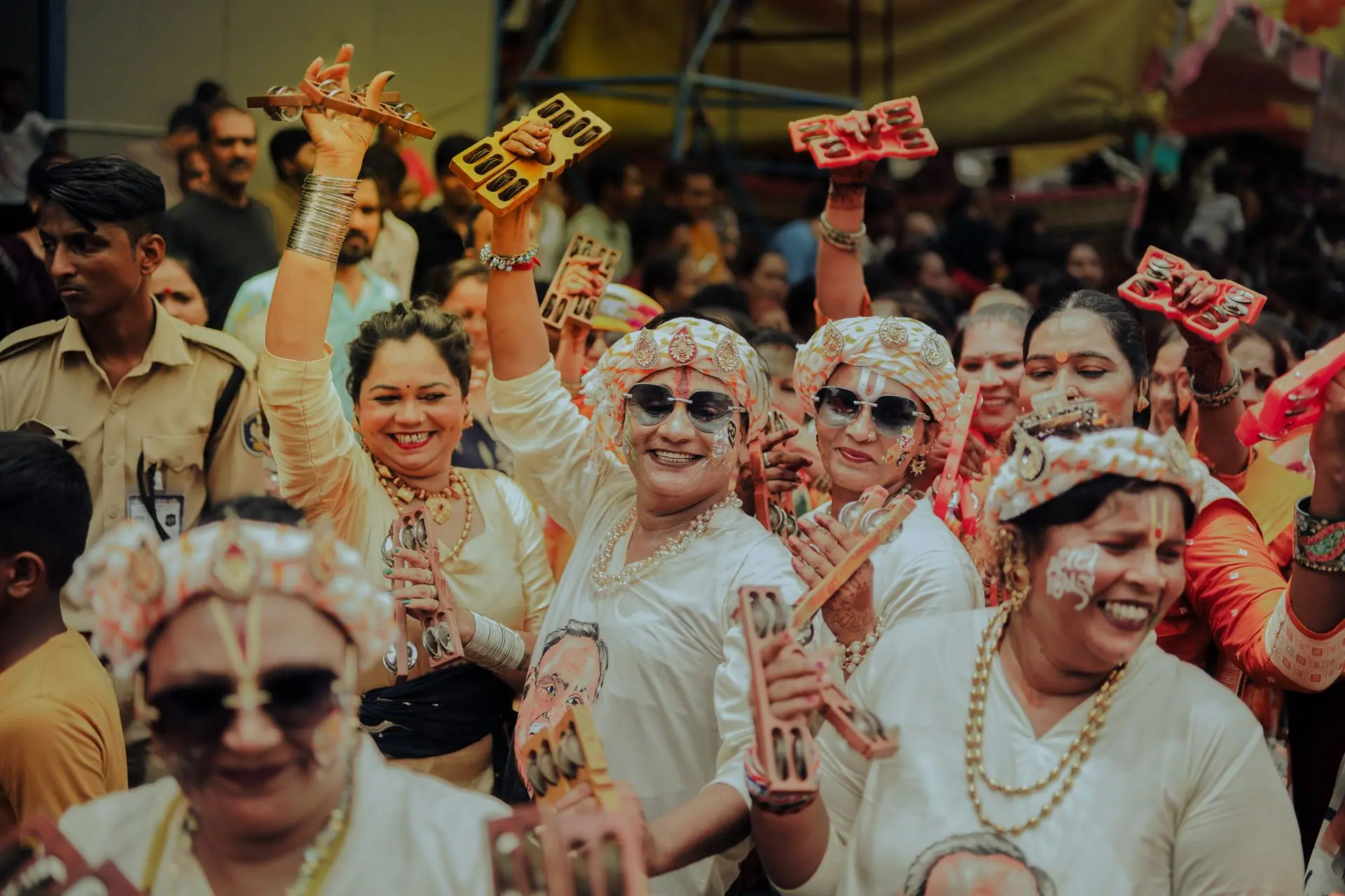 Joyful participants in colorful attire celebrate the Rathyatra festival in Ahmedabad, India, showcasing cultural exuberance