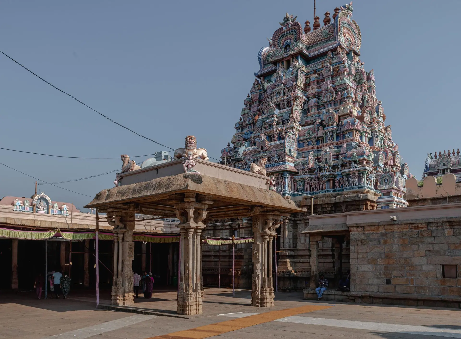 Stunning close-up of a colorful gopuram in a Hindu temple, showcasing intricate Dravidian architecture in Tamil Nadu, India