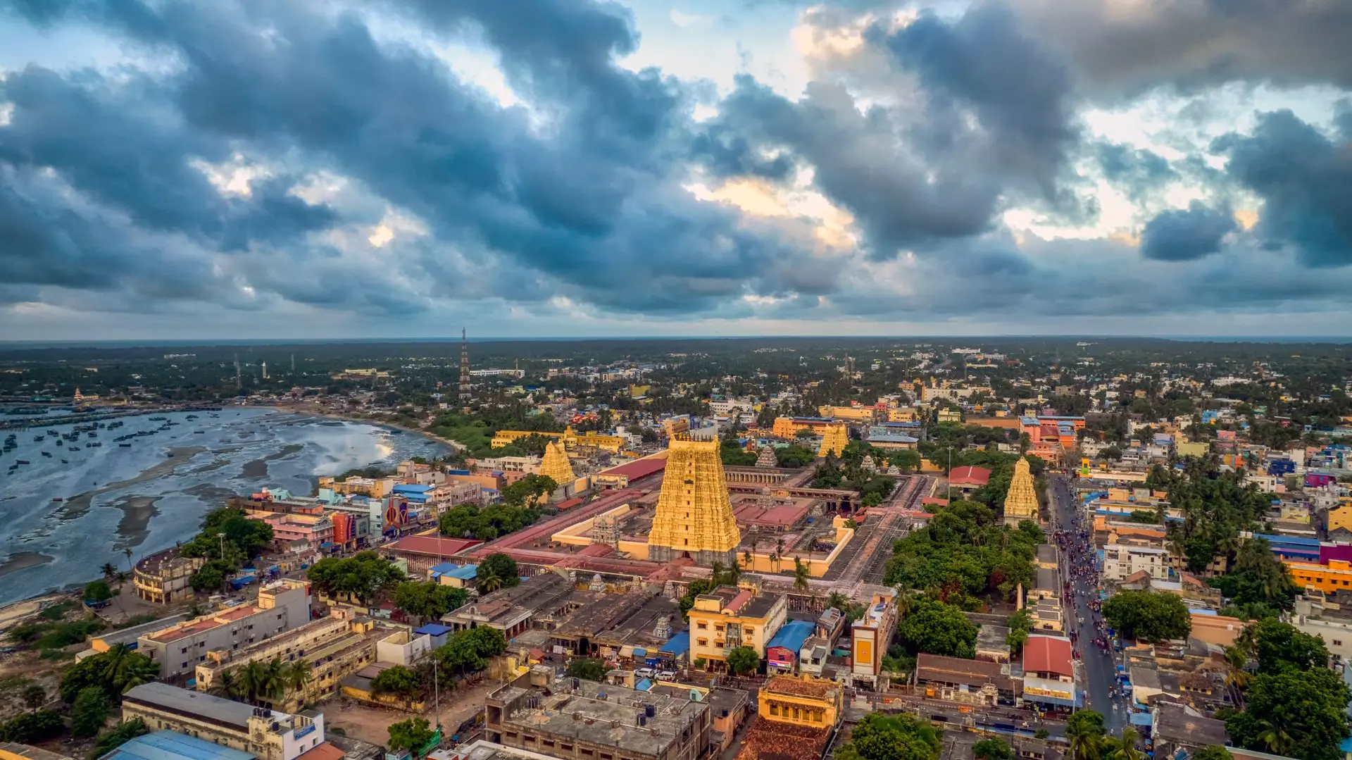 A stunning aerial view of Rameswaram, TN, India showcasing its iconic temples against a dramatic sky