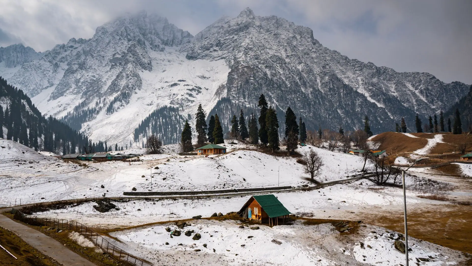 Snow-covered mountains and cabins in picturesque Sonamarg, a winter wonderland